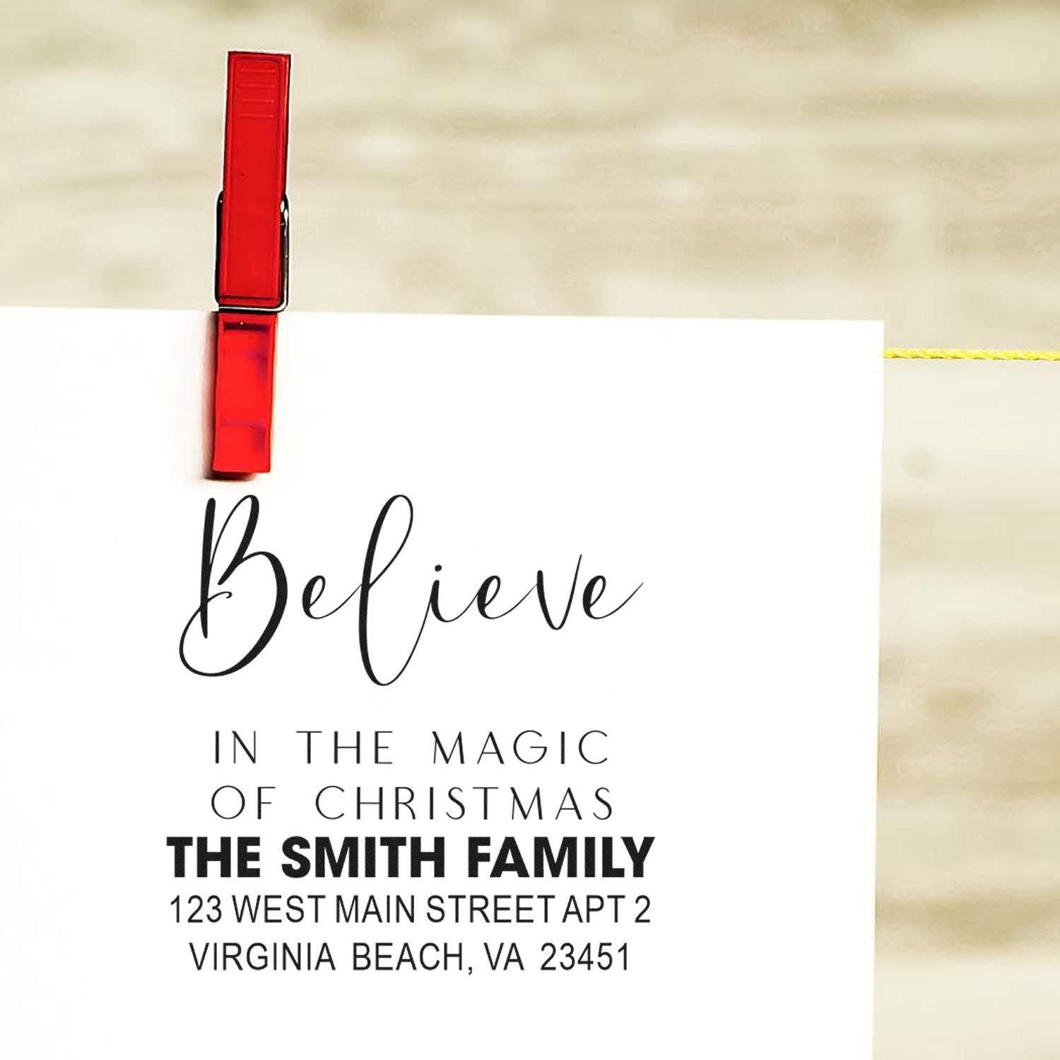 Custom Christmas rubber stamp for holiday cards with Believe in the Magic of Christmas personalized family name and address.