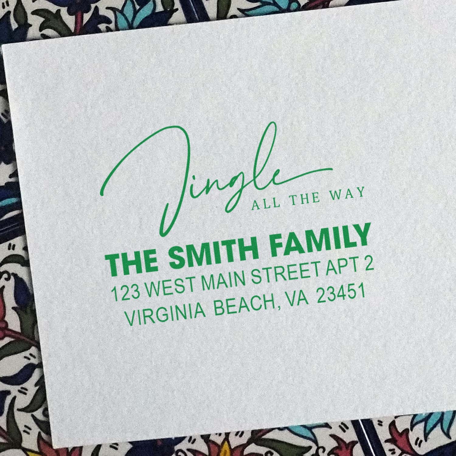 Custom return address rubber stamp for The Smith Family with Jingle all the way holiday design in green ink