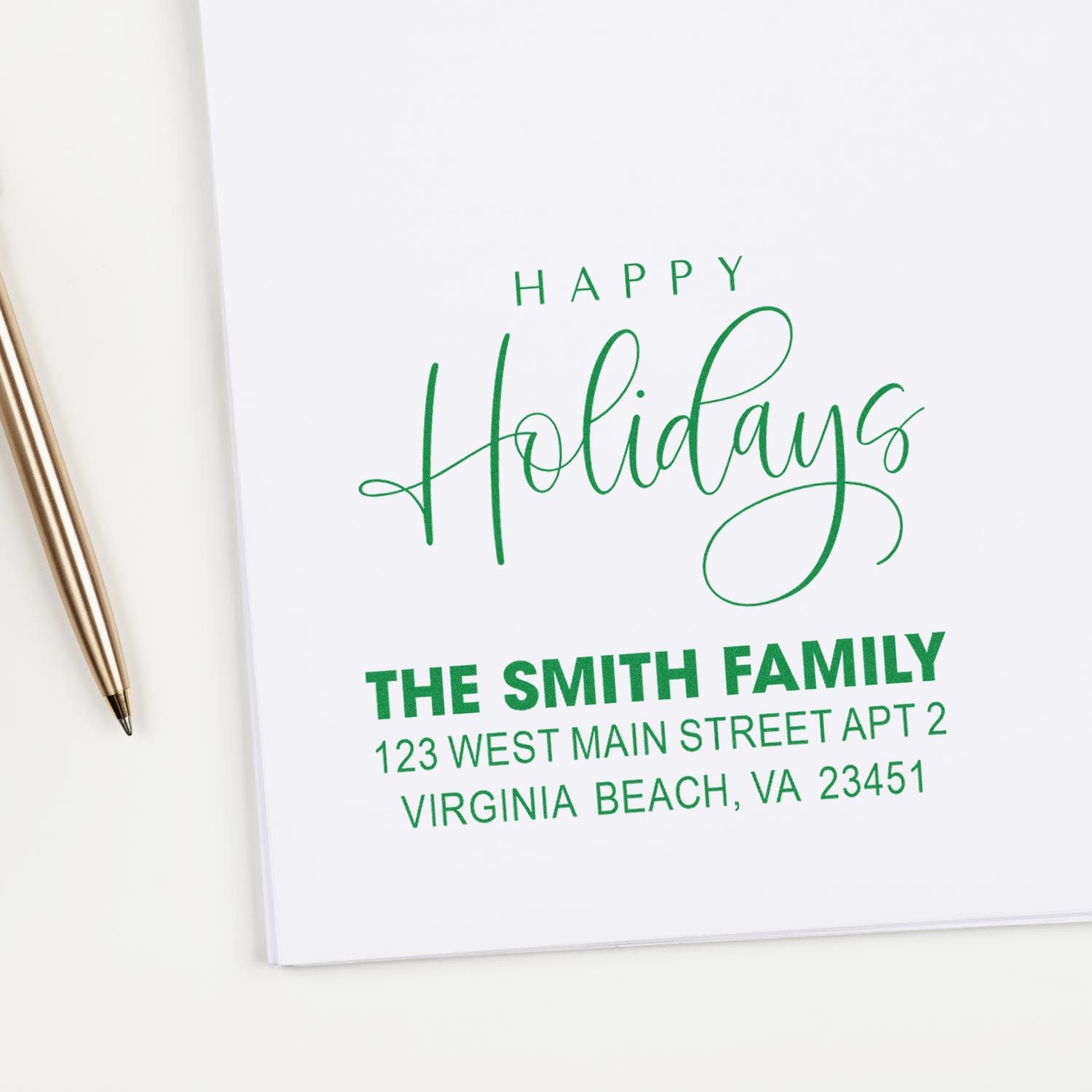 Personalized Happy Holidays rubber stamp with family name and address for festive Christmas card envelopes.