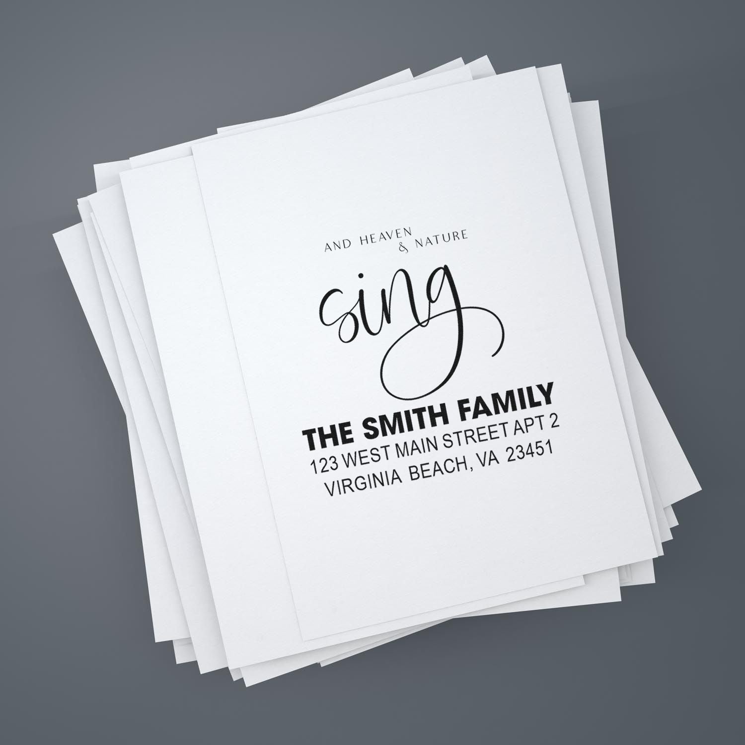 Personalized return address rubber stamp design for The Smith Family with name, address, and decorative sing lettering.