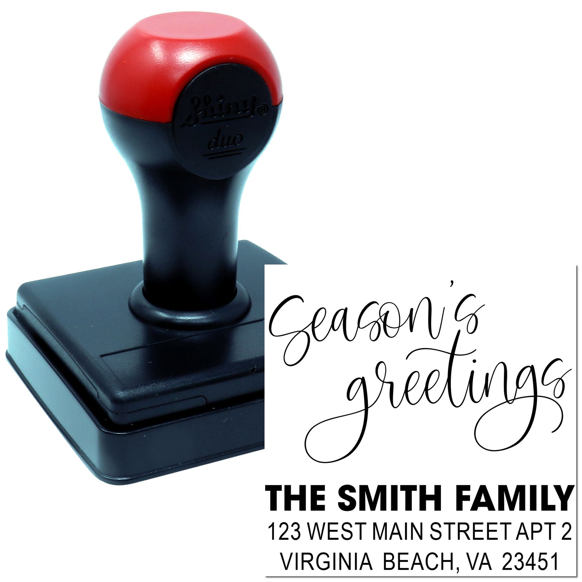 Custom self-inking rubber stamp with Seasons Greetings and The Smith Family return address.