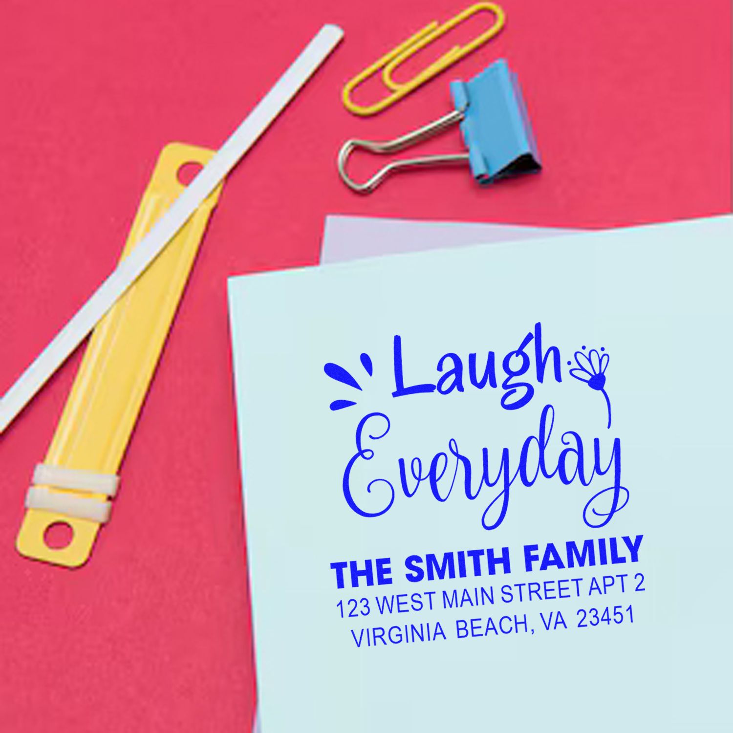 Personalized return address rubber stamp with Laugh Everyday design for custom family envelopes.