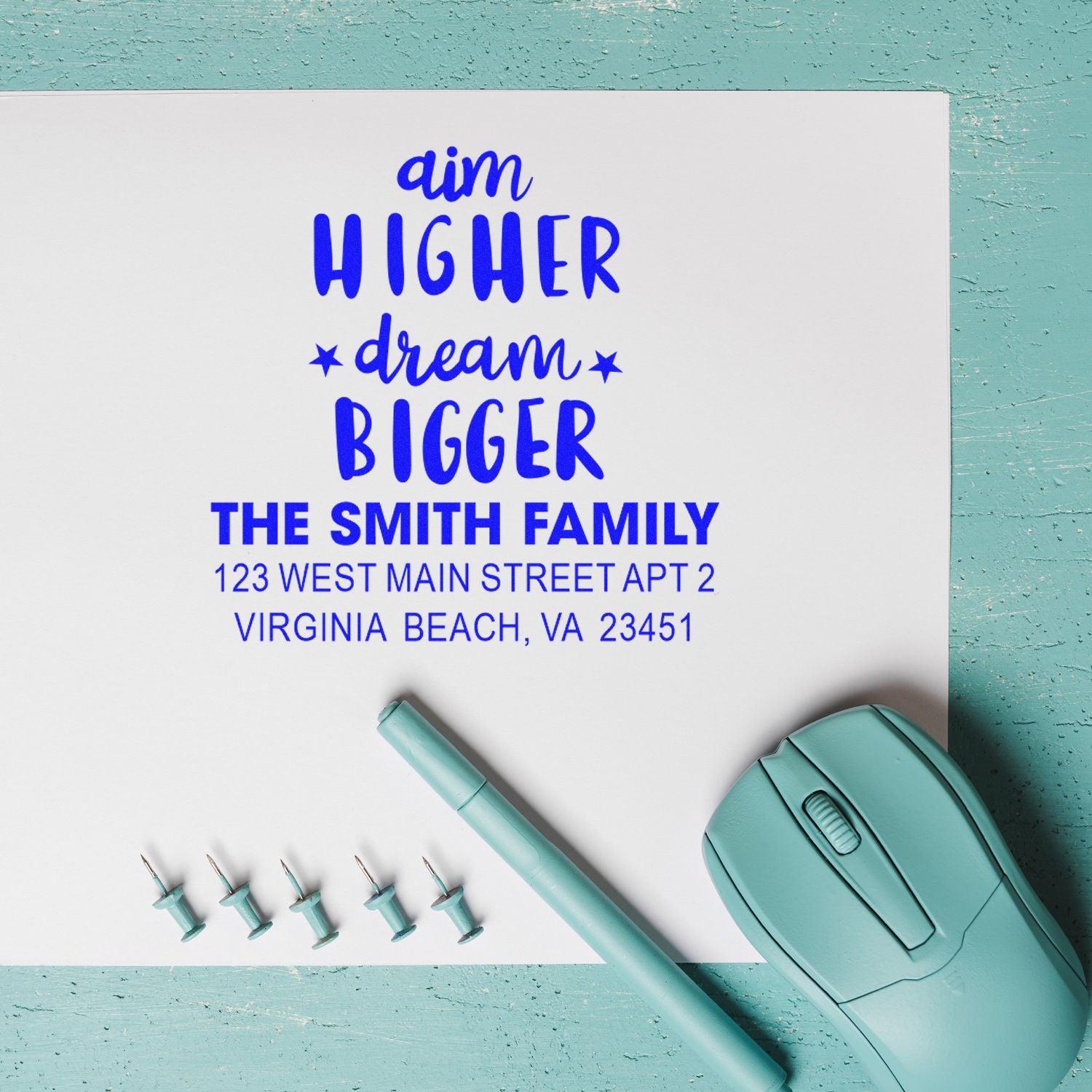Custom self-inking rubber address stamp with Aim Higher Dream Bigger and The Smith Family return address