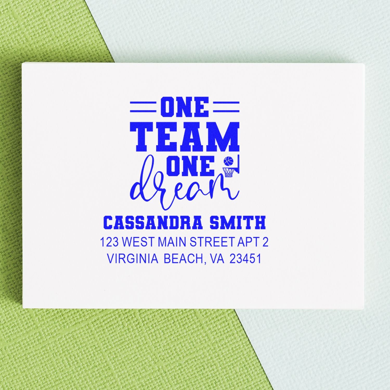 Personalized basketball rubber stamp design with One Team One Dream, name, and address for custom stationery.