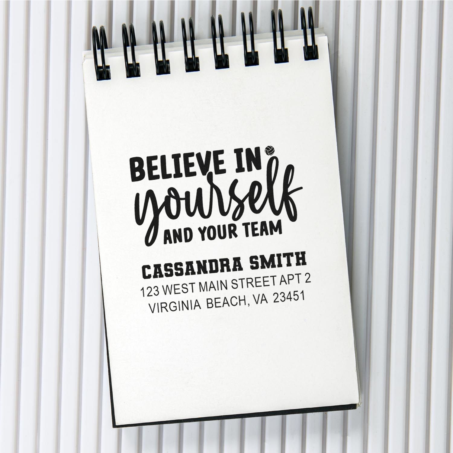 Custom rubber stamp design reading Believe in yourself and your team with personalized name and address.