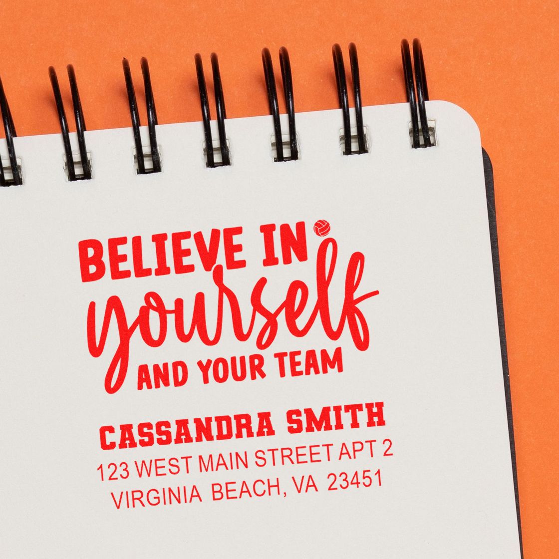 Custom rubber stamp with motivational quote, personalized name, and return address for business branding.