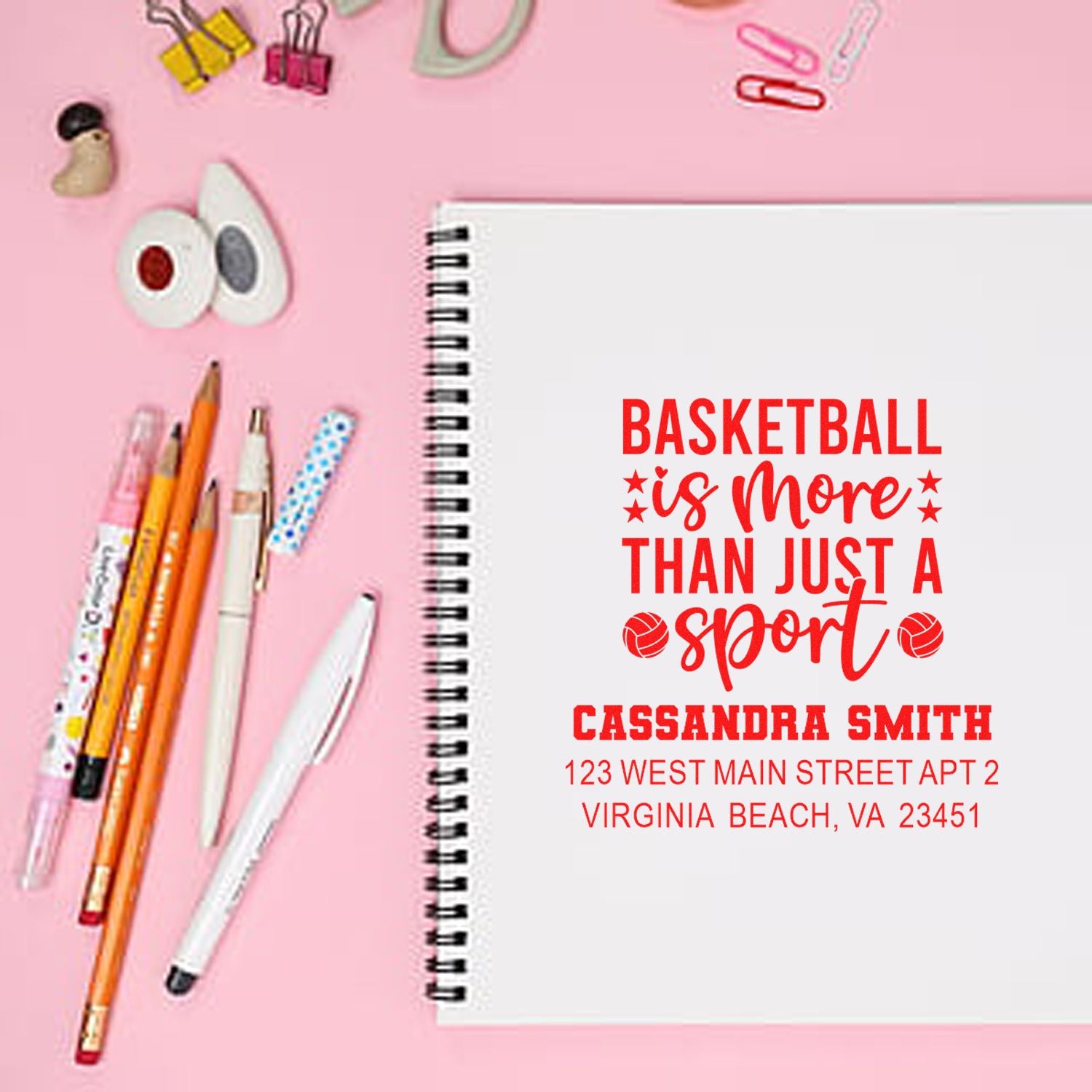 Personalized basketball quote rubber stamp with name and return address on a spiral notebook