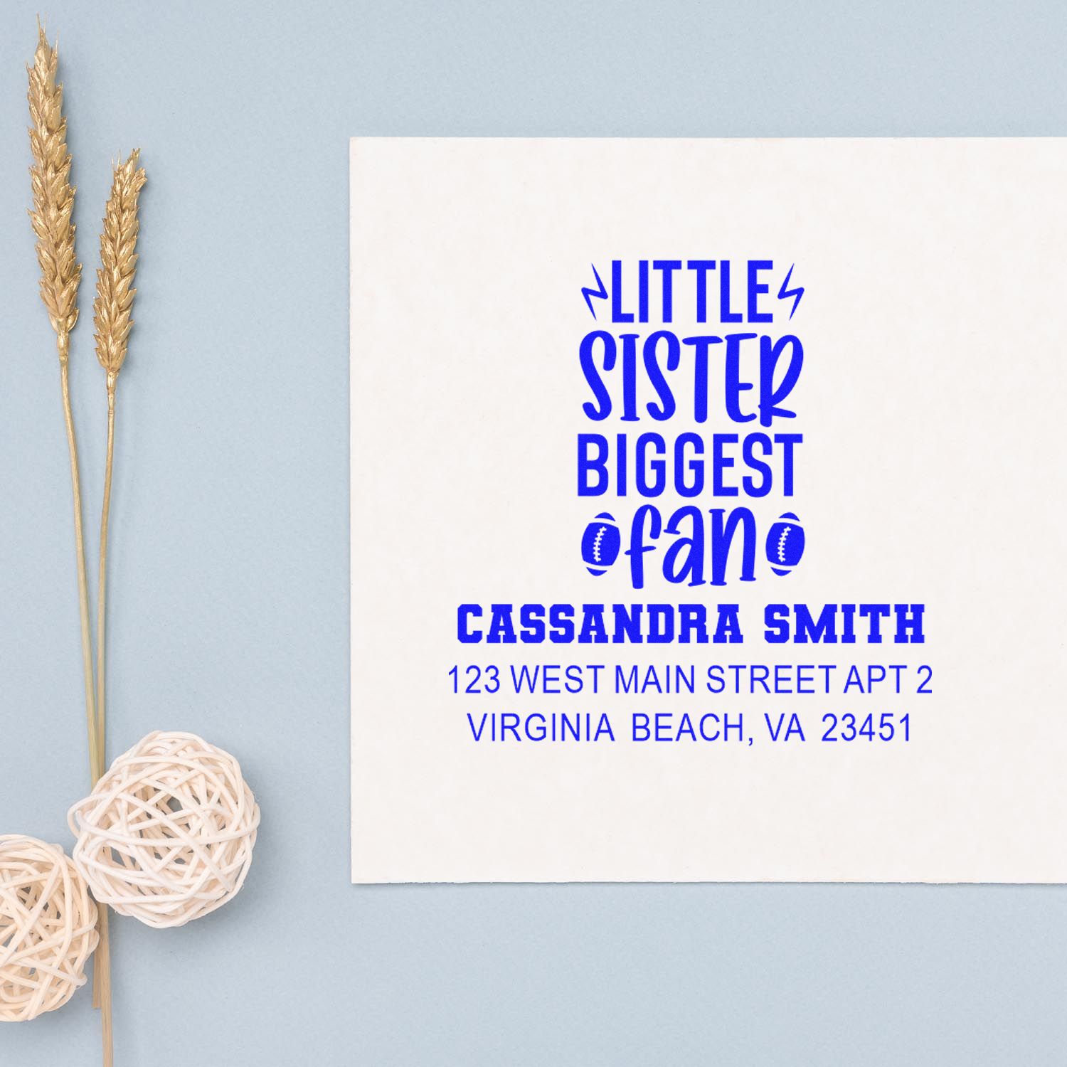 Personalized return address rubber stamp featuring Little Sister Biggest Fan and Cassandra Smith in bold blue.