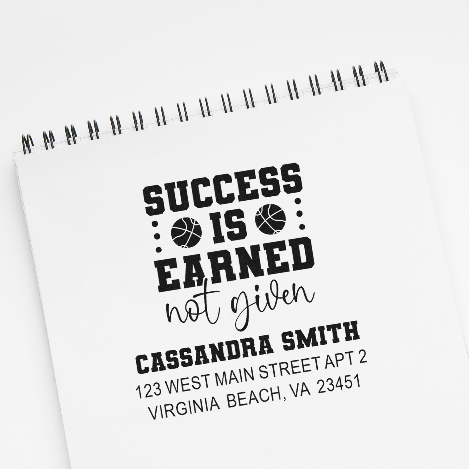 Custom rubber stamp with motivational quote, name, and address for personalized stationery.
