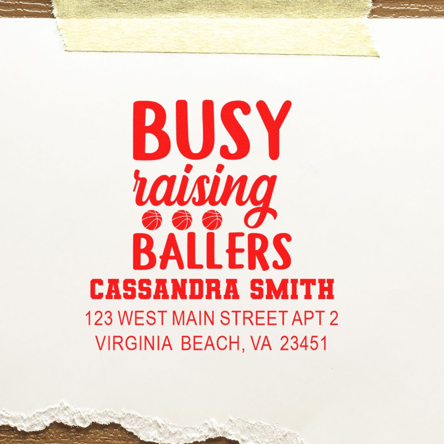 Custom rubber address stamp with "Busy raising ballers," basketball icons, and Cassandra Smith return address in Virginia Beach, VA.