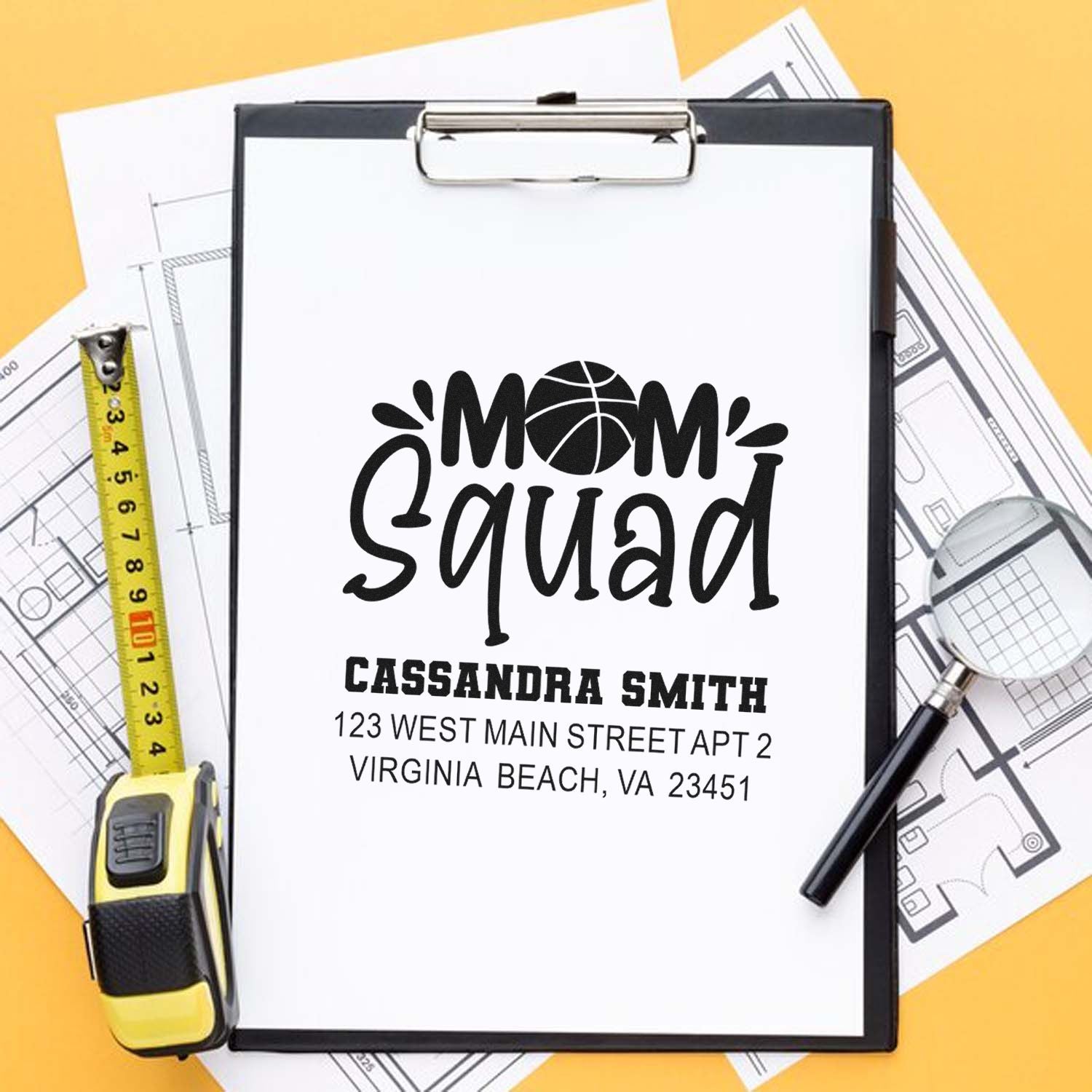 Custom Mom Squad rubber stamp design with basketball logo, name and address on clipboard, ideal for personalized address stamping.