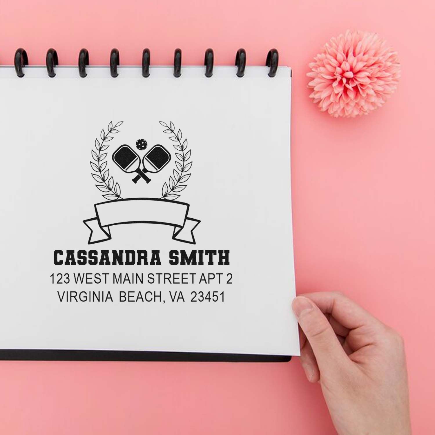 Custom pickleball rubber stamp with crossed paddles, laurel wreath, and Cassandra Smith return address.