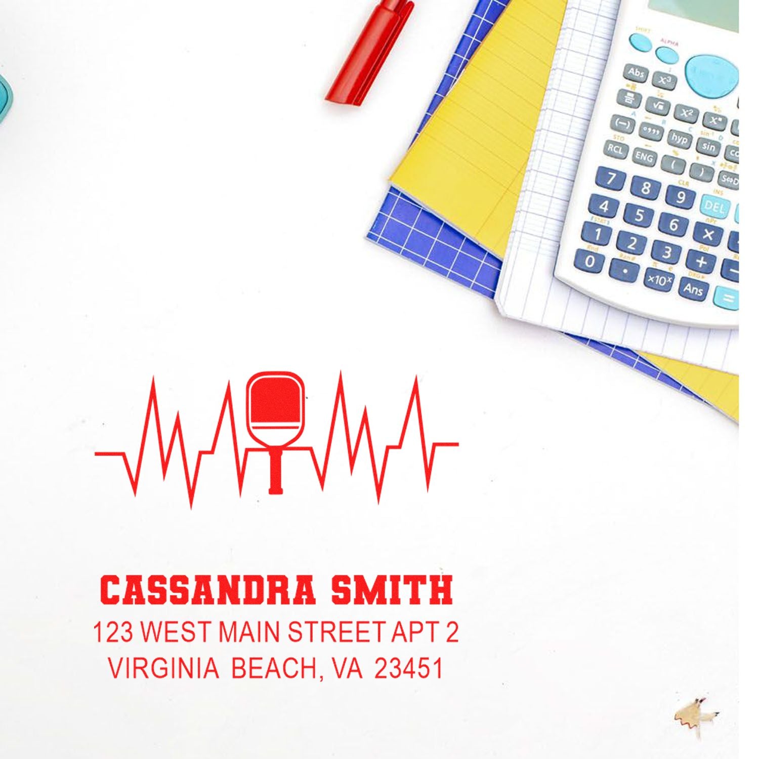 Custom rubber address stamp with heartbeat blood drop logo and return mailing details for personal correspondence.