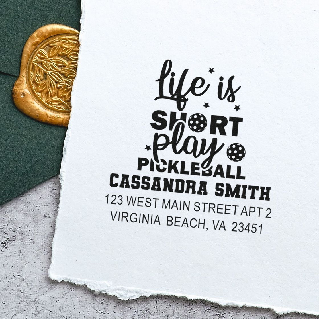 Custom rubber stamp with Life Is Short, Play Pickleball message and return address for Cassandra Smith.