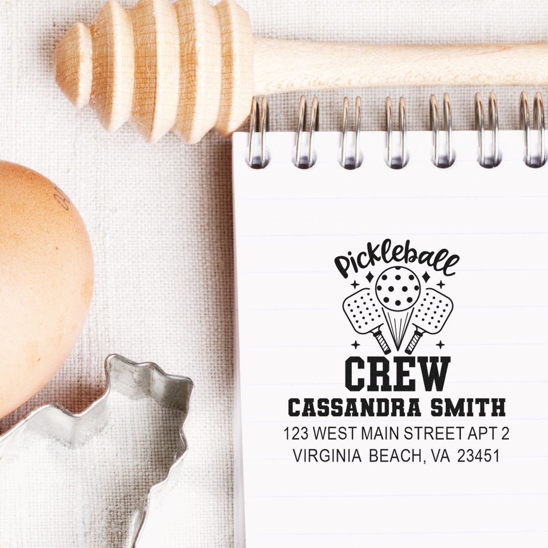 Custom pickleball crew address stamp on notebook with personalized name and Virginia Beach, VA address.