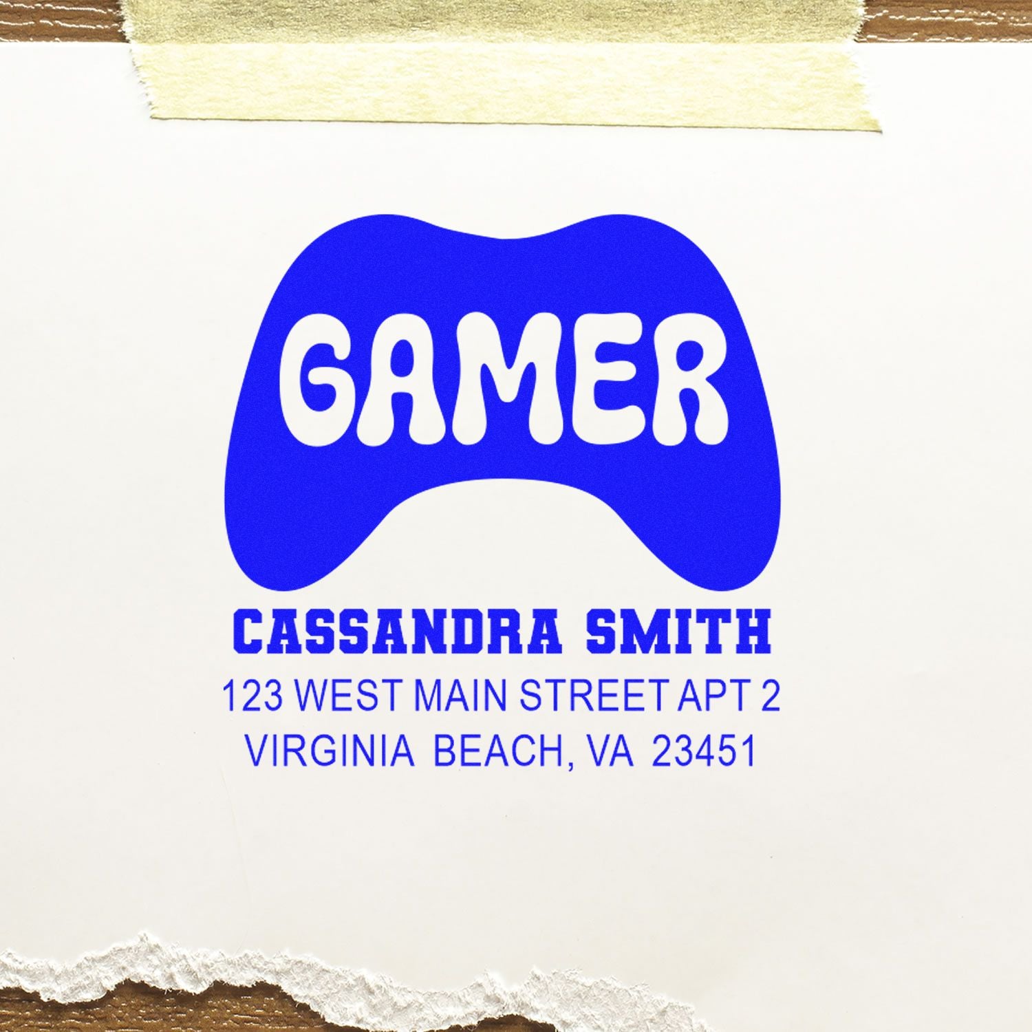 Custom gamer rubber stamp with game controller logo and return address for Cassandra Smith, Virginia Beach, VA.