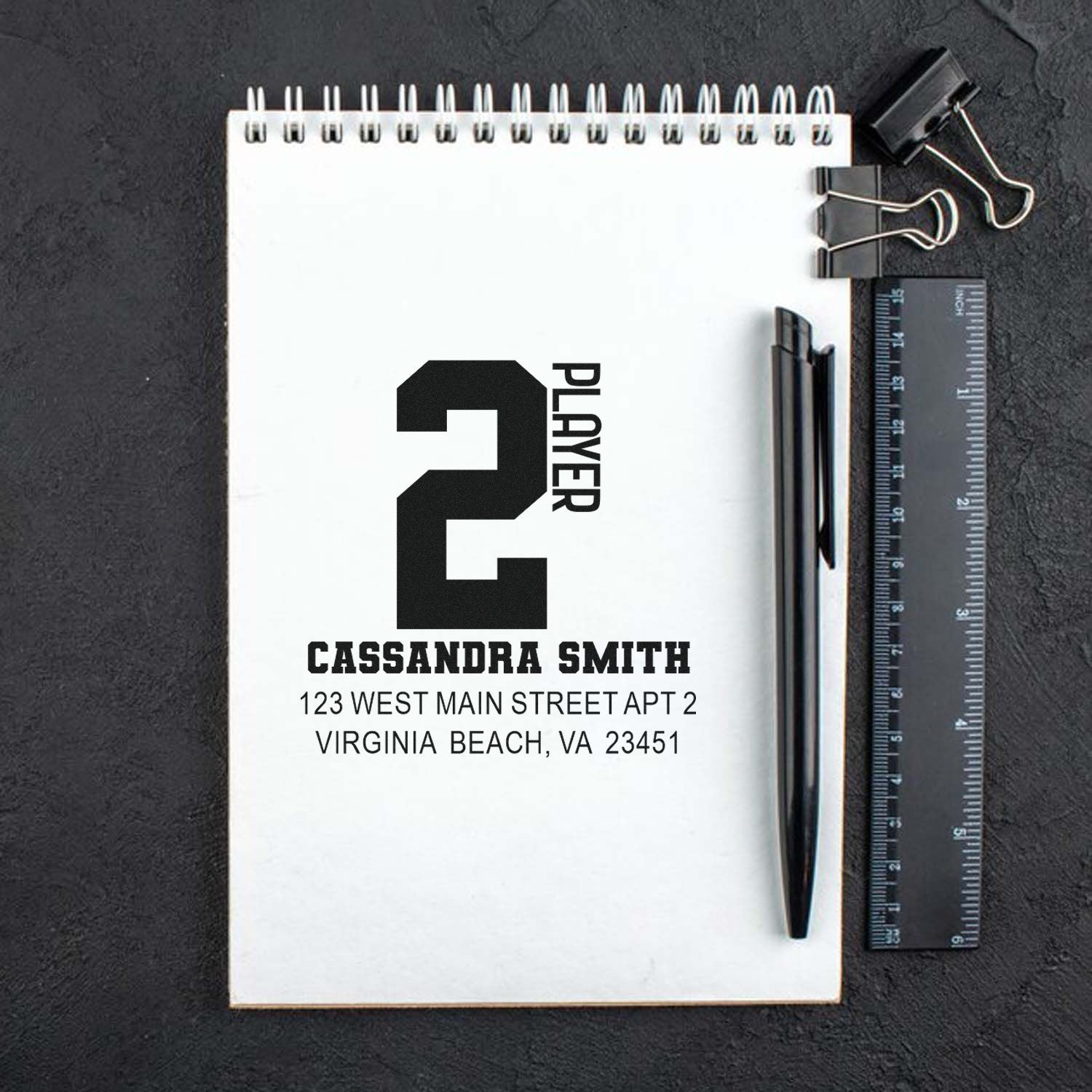 Custom rubber stamp design for Player 2 with name and return address, ideal for personalized stationery and mailing.