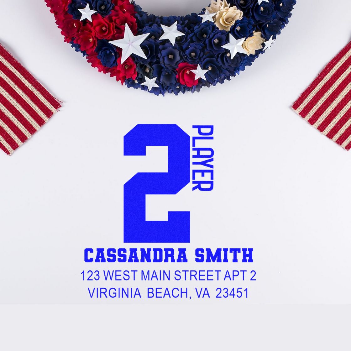 Custom return address rubber stamp for Cassandra Smith, featuring a blue Player 2 design for patriotic party invitations.