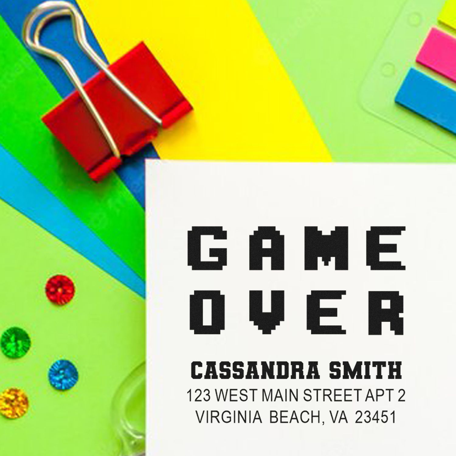 Game Over custom rubber stamp design with name and address for personalized gamer stationery.
