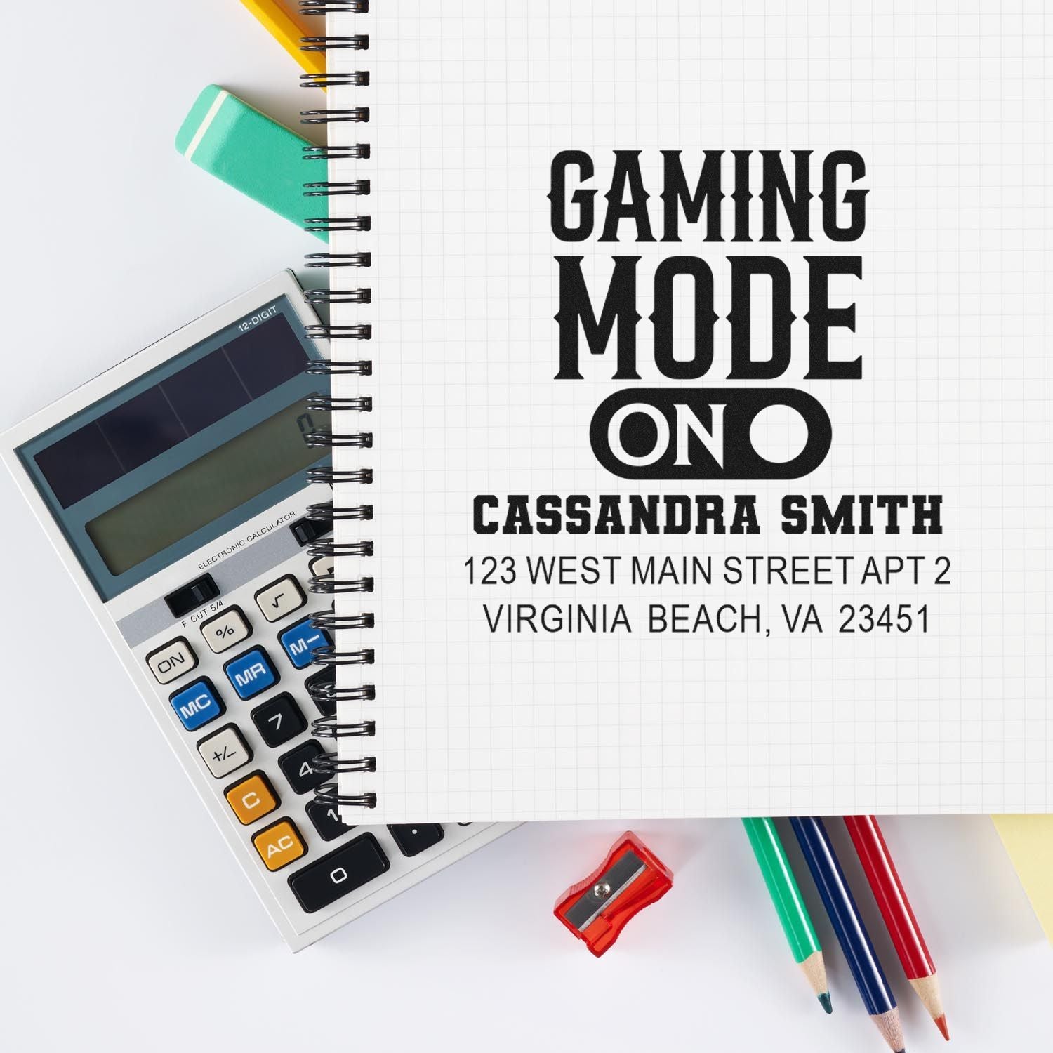 Custom rubber stamp imprint reading Gaming Mode On with name and address on notebook, for personalized gaming stationery.