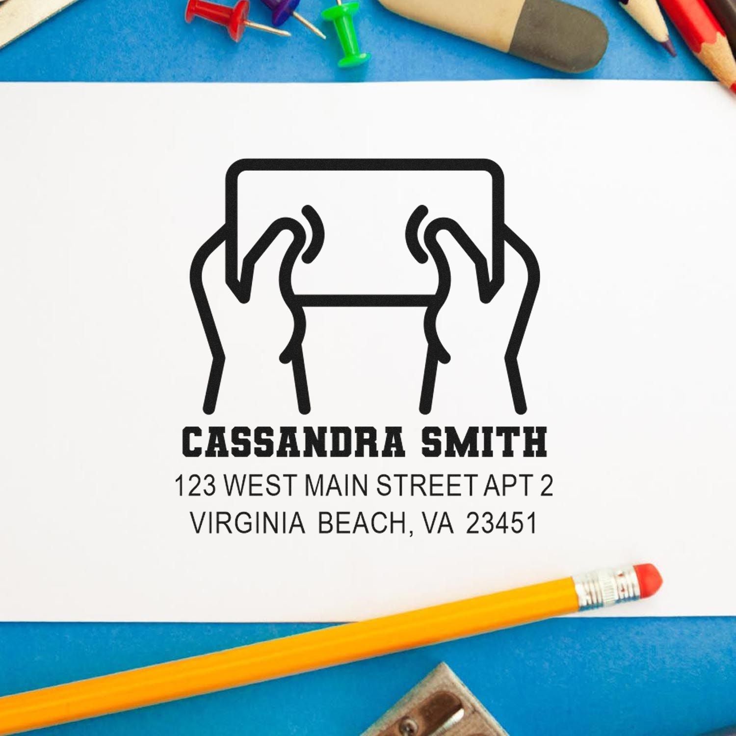 Custom return address rubber stamp with name, Virginia Beach address, and logo for stationery and mailings.