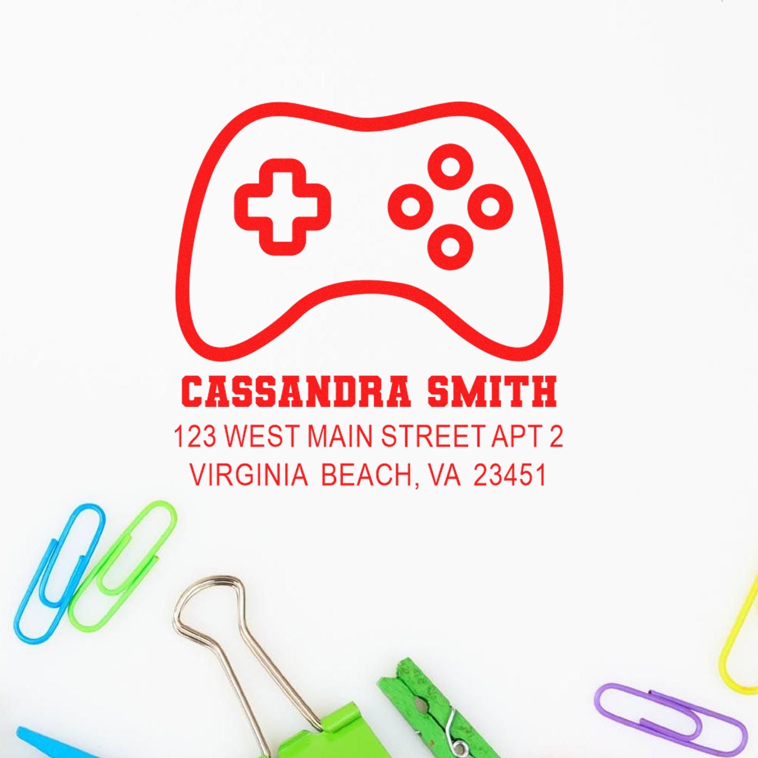 Custom rubber stamp with game controller logo and personalized address for Cassandra Smith, Virginia Beach mailing branding.