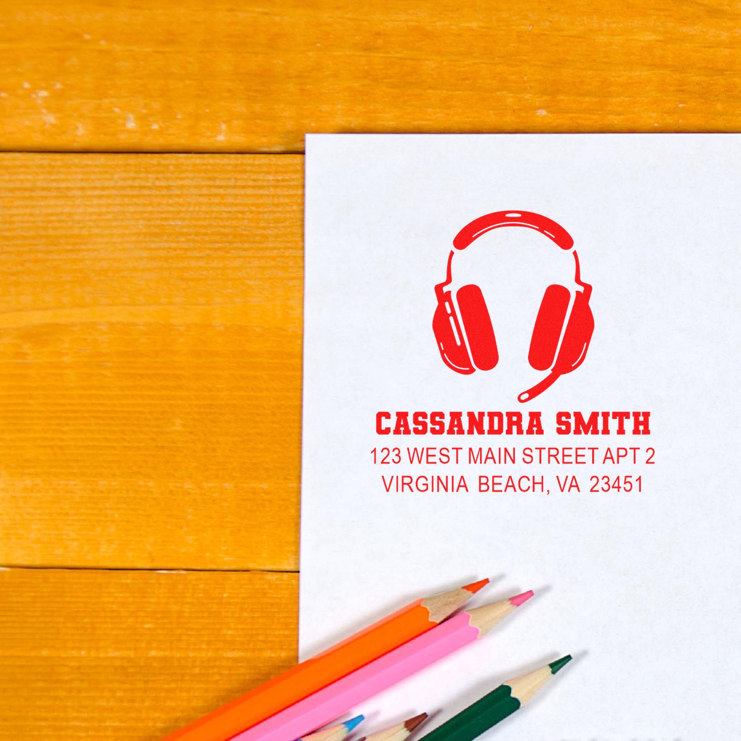 Custom address rubber stamp with headset logo for Cassandra Smith return address on stationery