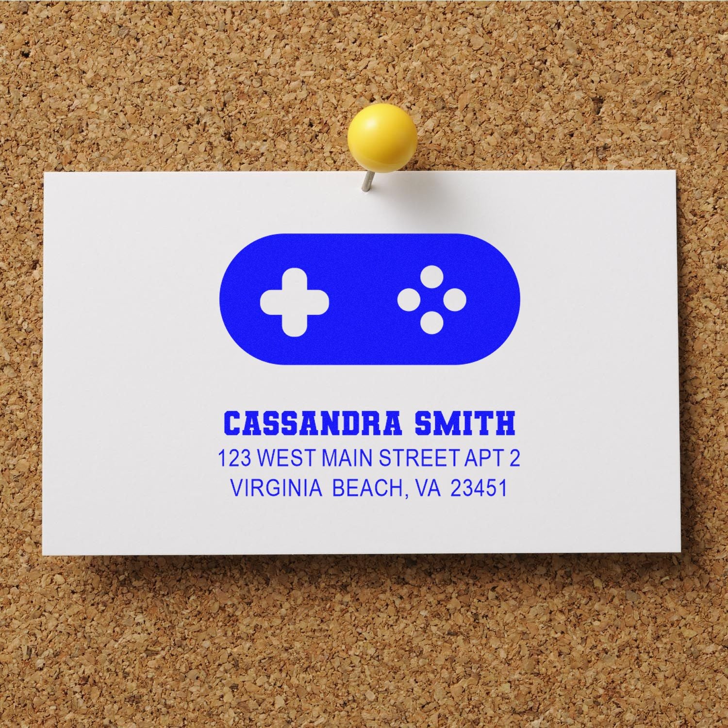 Custom return address rubber stamp design for Cassandra Smith, featuring a gaming controller icon and Virginia Beach address.