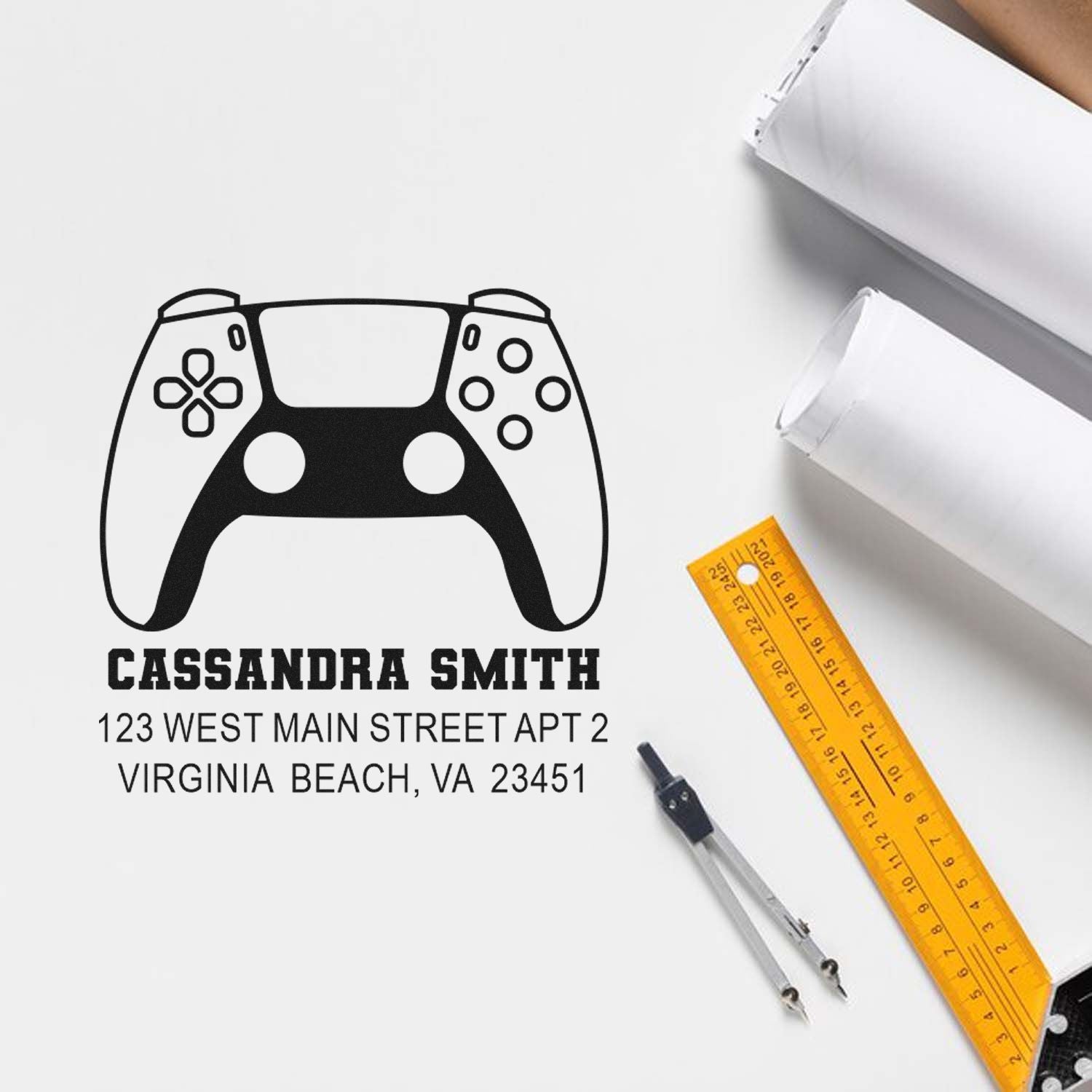 Custom address rubber stamp with gamer controller design for Cassandra Smith, 123 West Main Street, Virginia Beach, VA.