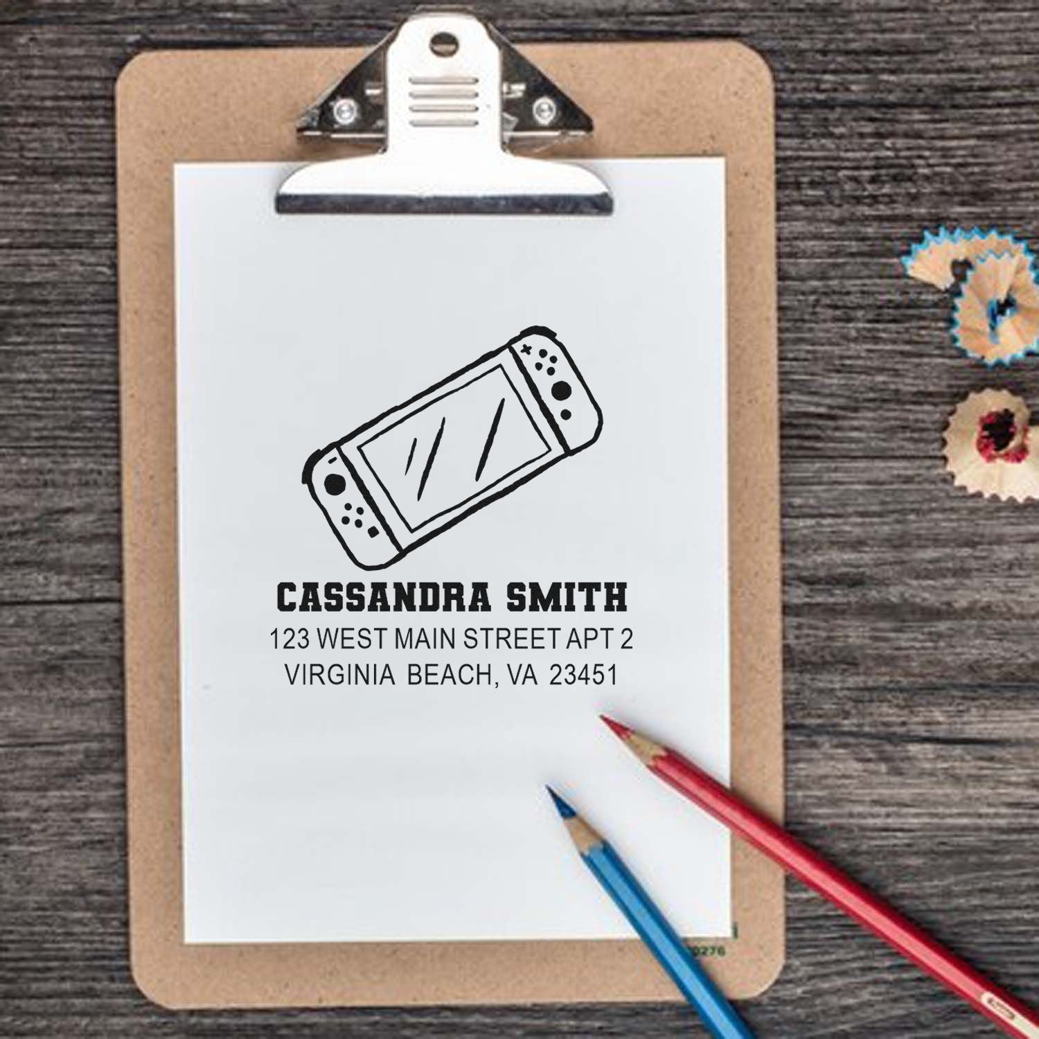 Custom return address rubber stamp with bandage logo, name, and address for personalized mail and stationery.