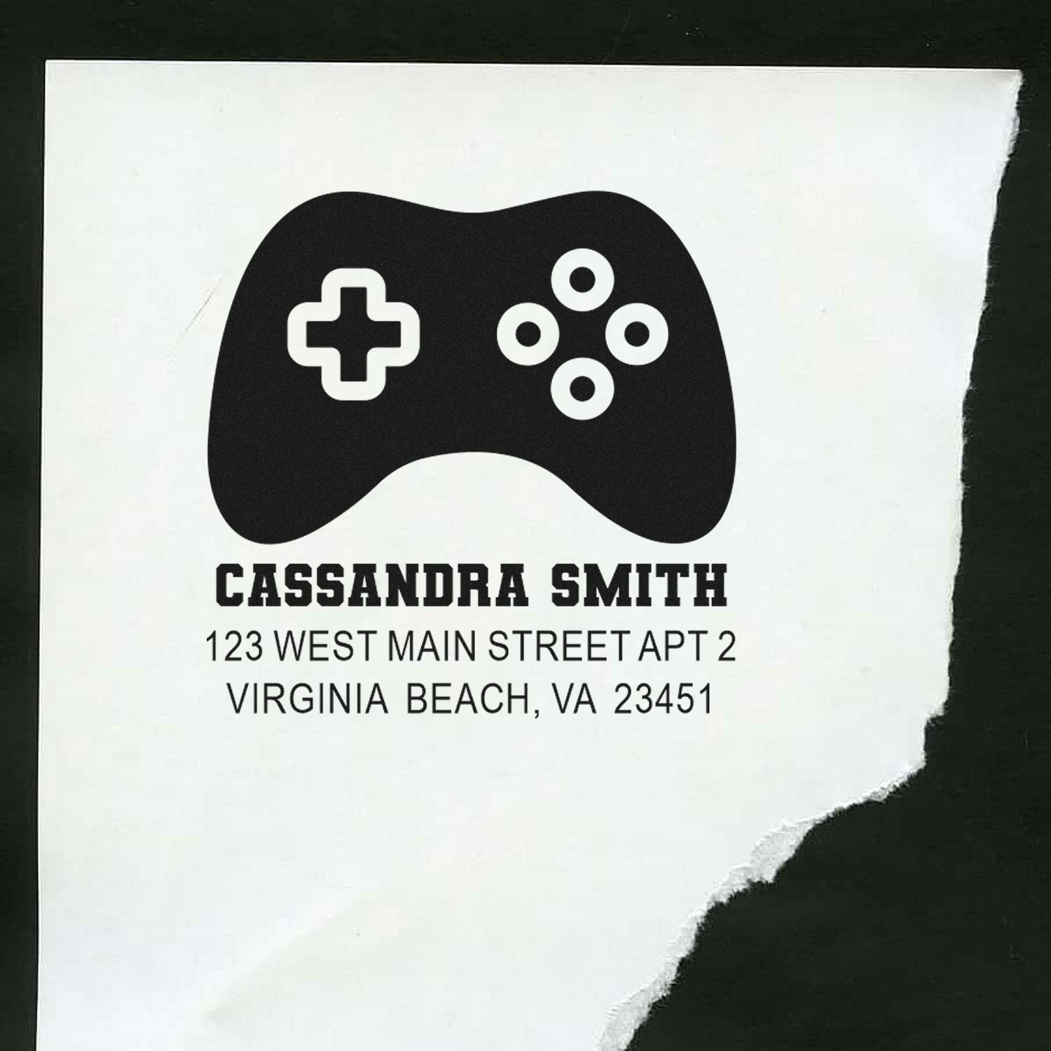 Personalized rubber return address stamp with game controller icon, Cassandra Smith name, and Virginia Beach, VA address.