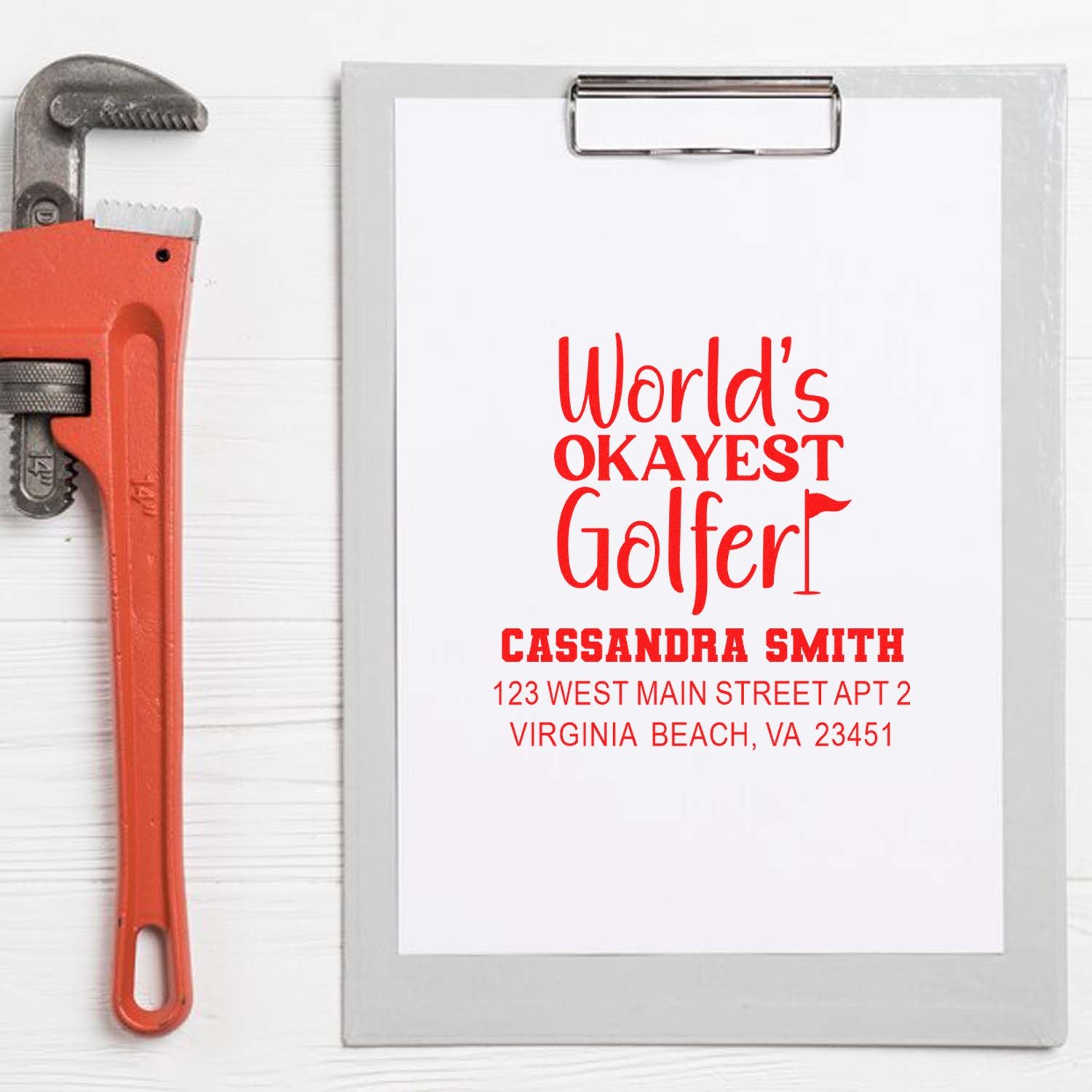 Personalized golfer address rubber stamp mockup with Worlds Okayest Golfer and return address for Cassandra Smith.