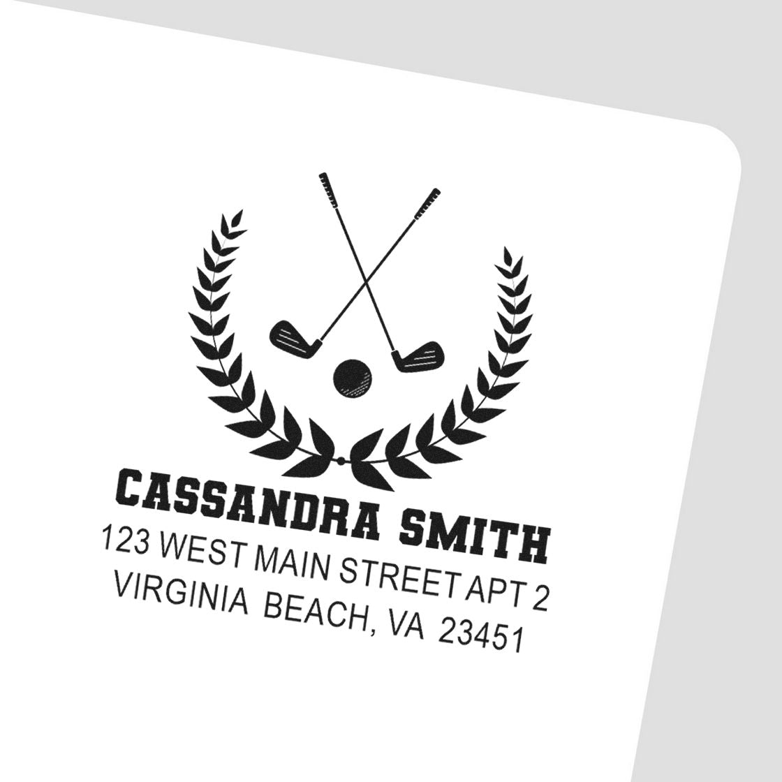 Custom golf address rubber stamp with crossed clubs, laurel wreath, name, and return address for personalized mailing.