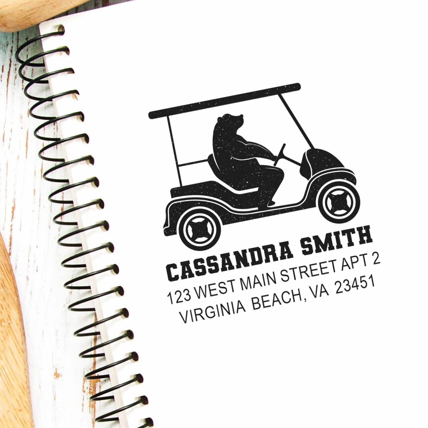 Custom return address rubber stamp with golf cart bear logo, personalized name and address for mailing.