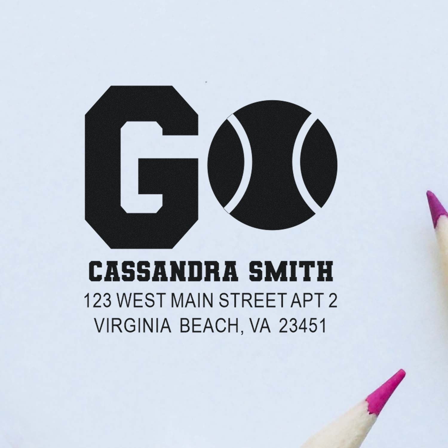Custom address rubber stamp with GO tennis-ball logo, Cassandra Smith name, and Virginia Beach, VA mailing details.