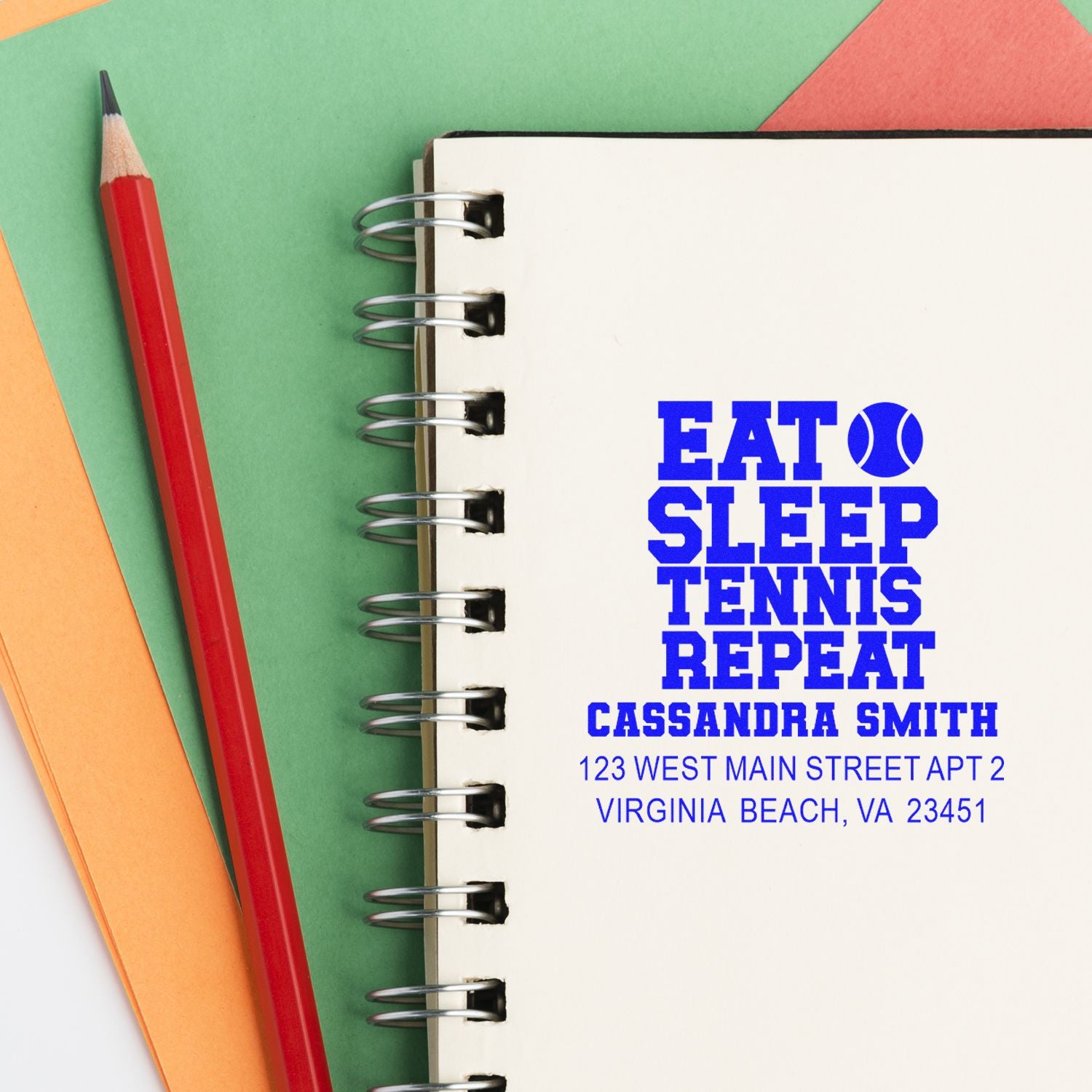 Custom tennis rubber stamp on notebook with Eat Sleep Tennis Repeat and address details for Cassandra Smith.