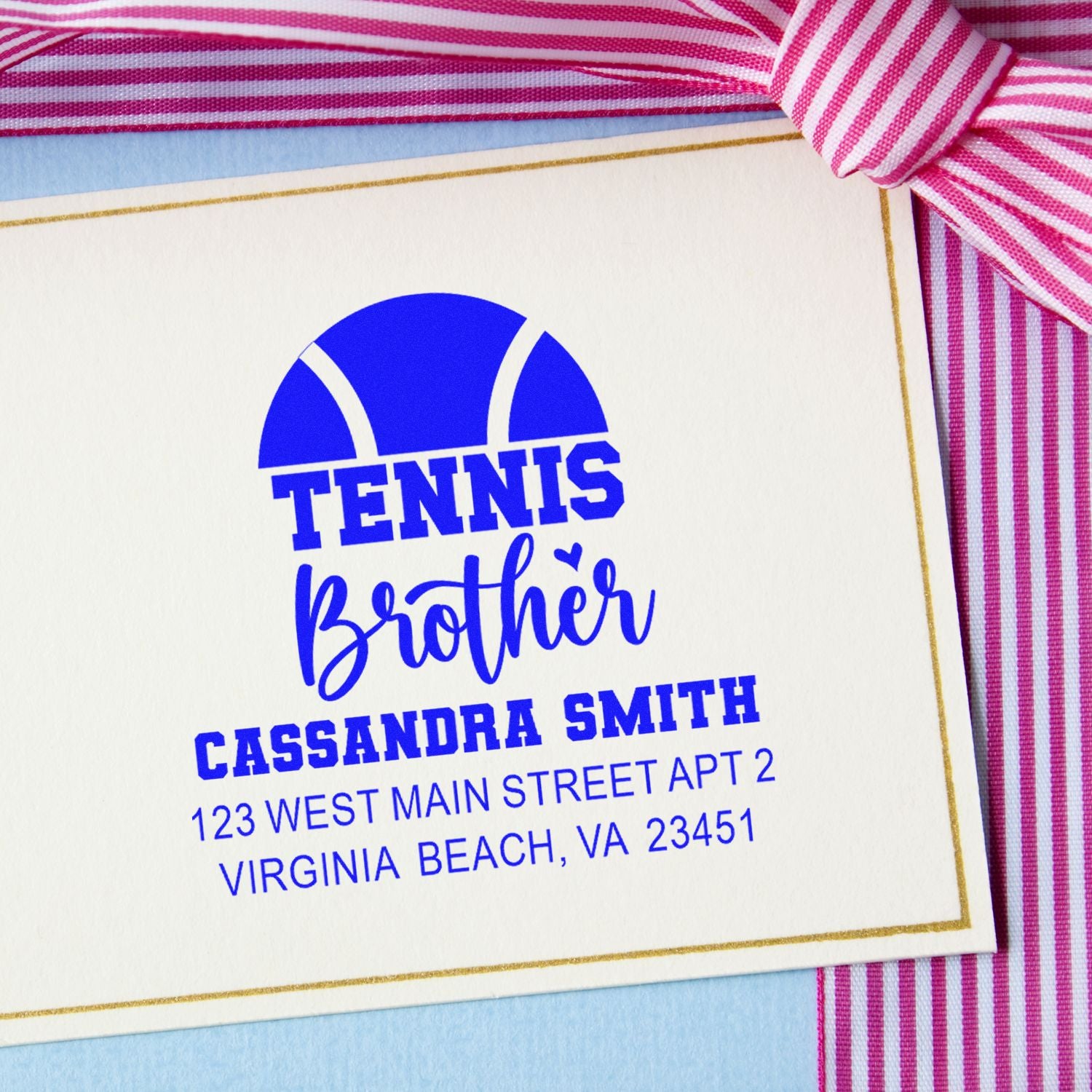 Personalized tennis brother rubber stamp with blue tennis ball design, name, and address for custom stationery.