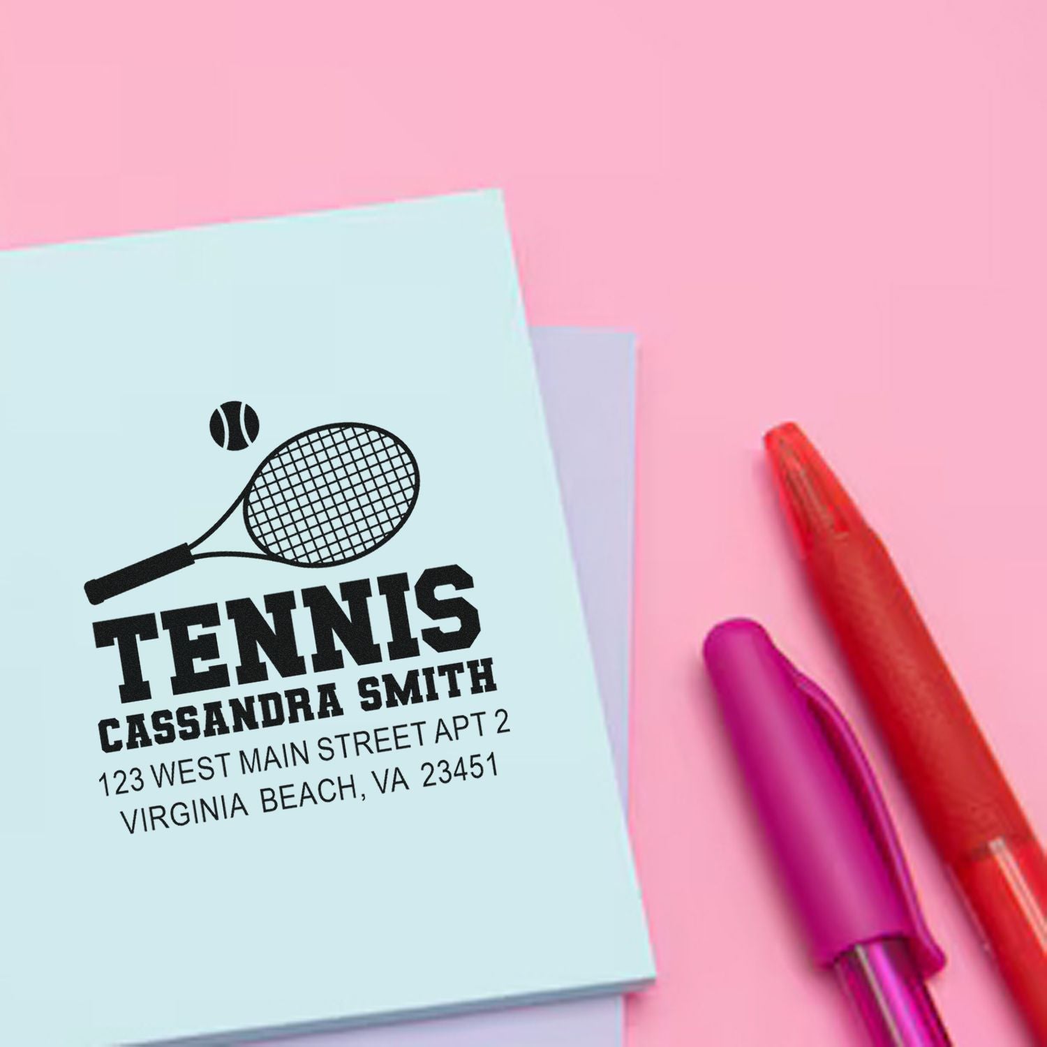 Custom tennis address rubber stamp design with racket icon, name, and address for personalized mail and stationery.