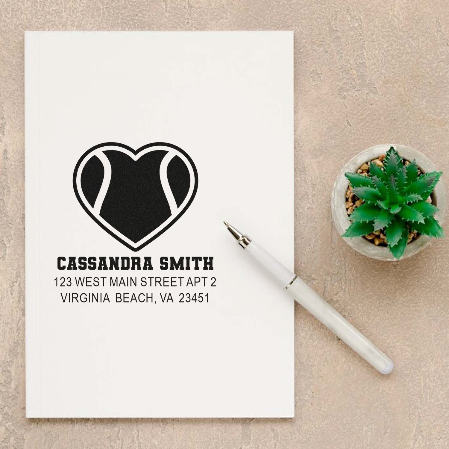 Custom address rubber stamp with heart logo, Cassandra Smith name, and Virginia Beach address for personalized mail.