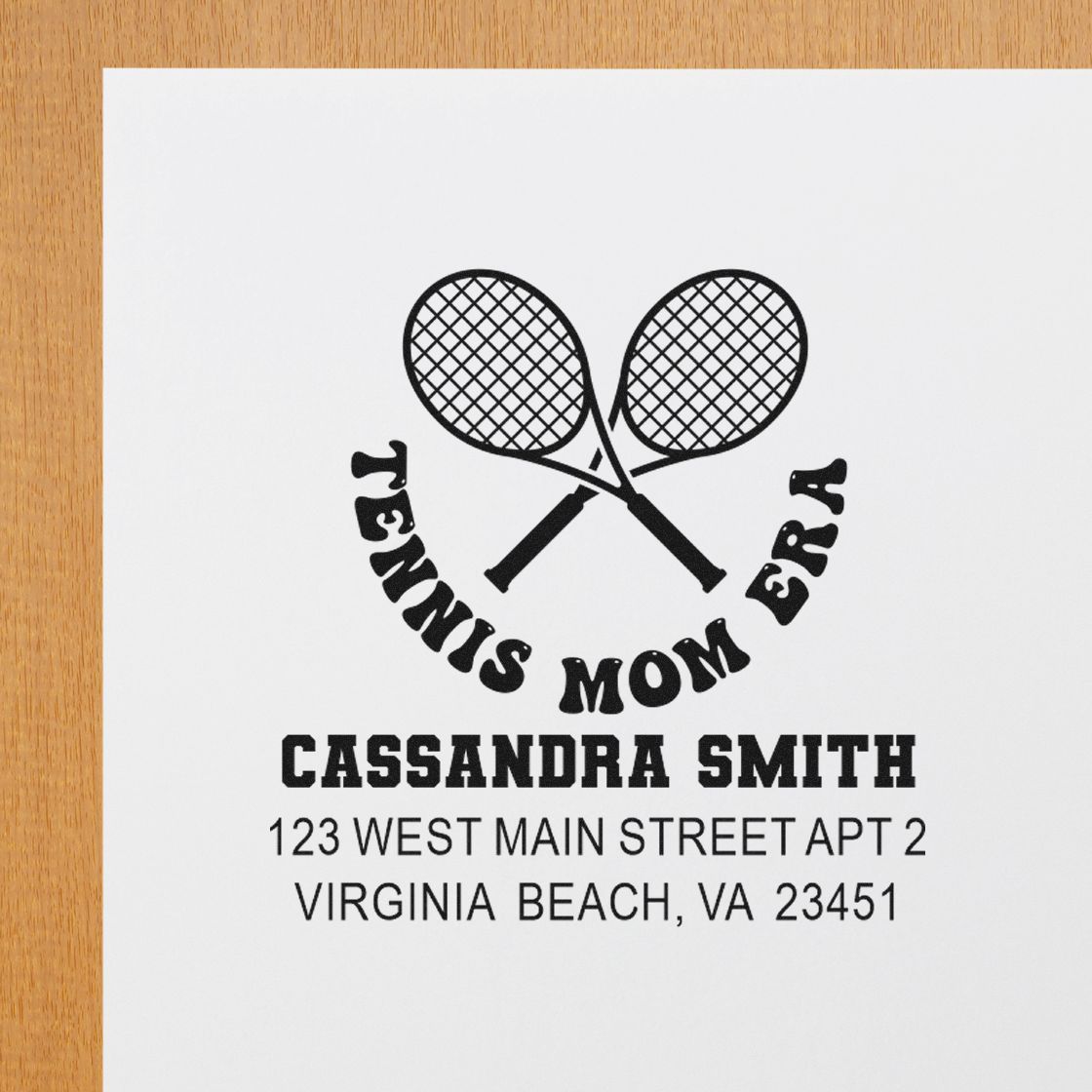 Custom tennis mom address rubber stamp with crossed rackets, name, and mailing address for personalized stationery.