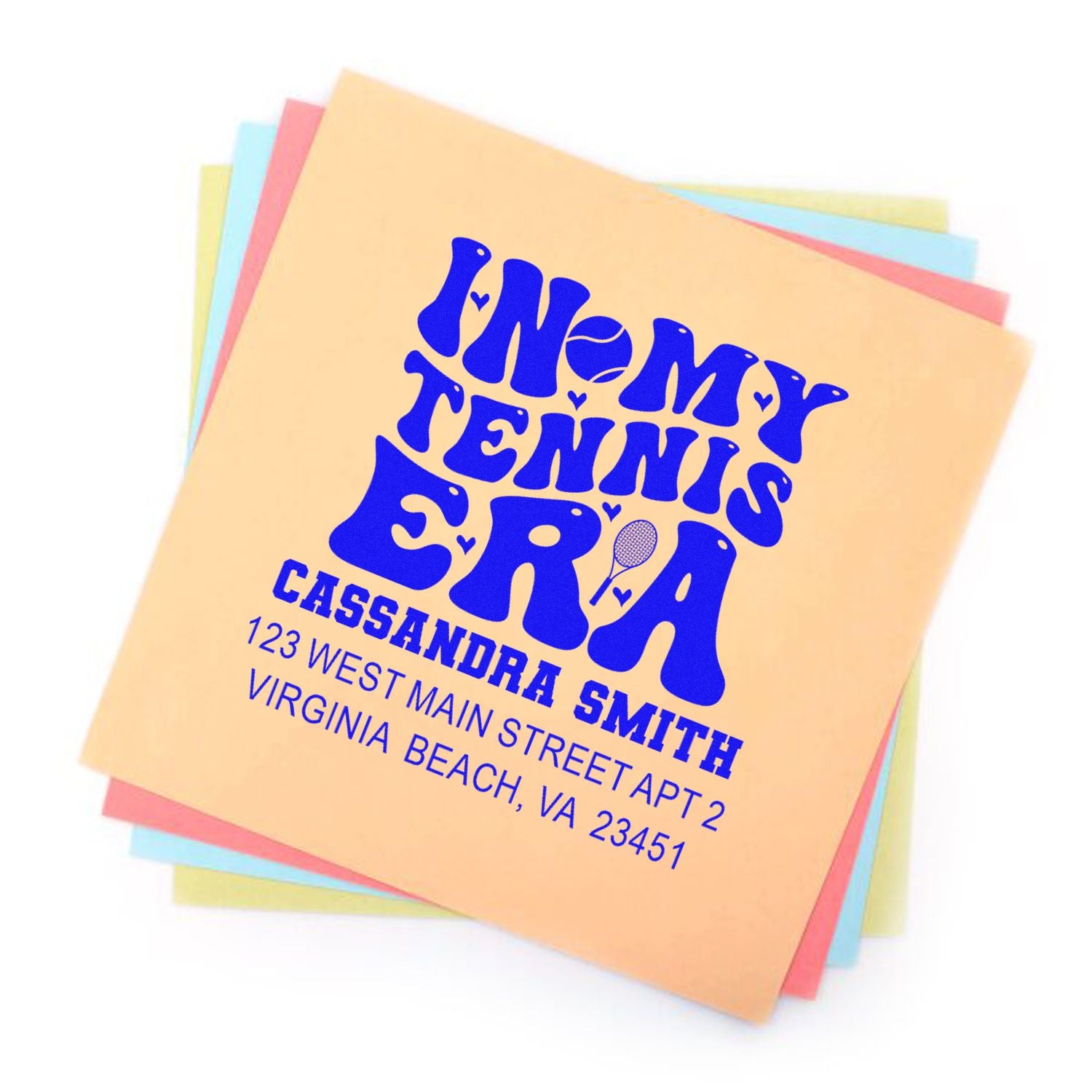 Custom tennis-themed return address rubber stamp with name and address on pastel paper, ideal for personalized mailing.