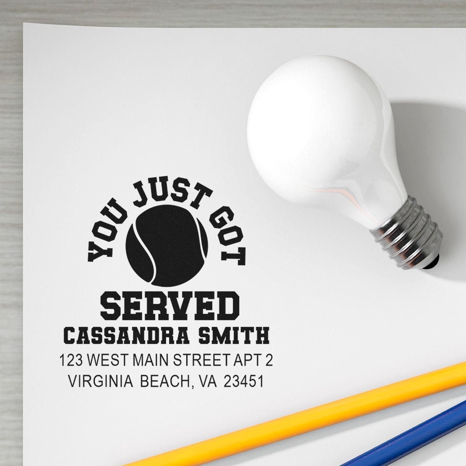 Custom tennis return address rubber stamp with You Just Got Served design, name, and address for personalized mail.