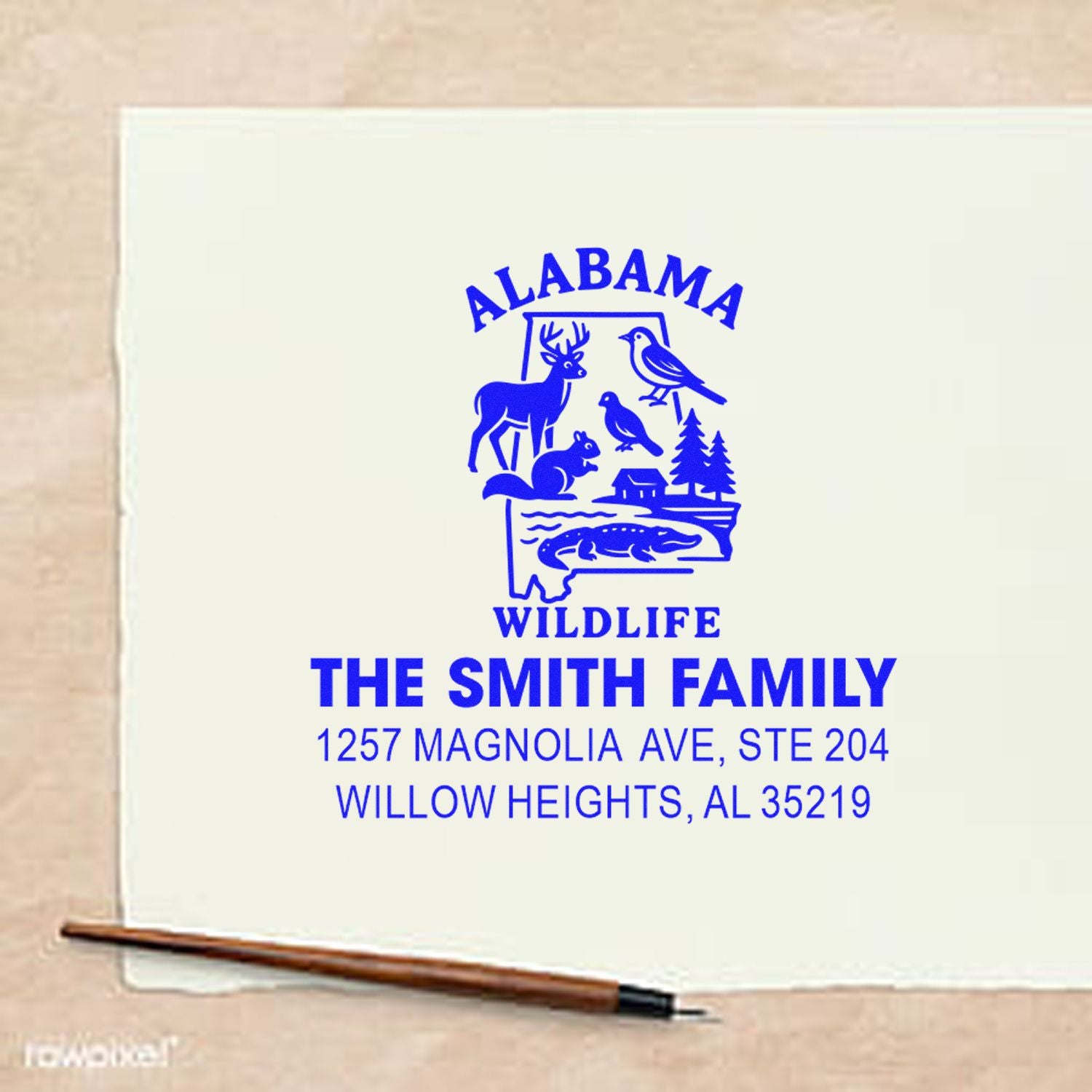 Custom Alabama wildlife rubber address stamp for The Smith Family with return address and nature-themed state design.