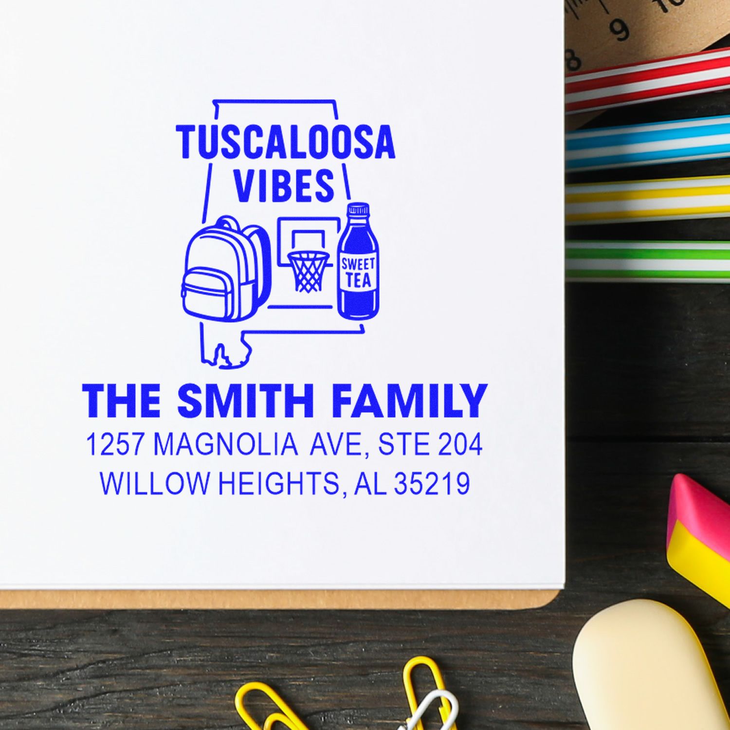 Custom rubber return address stamp for The Smith Family, Tuscaloosa Vibes design, with Alabama address and local icons.