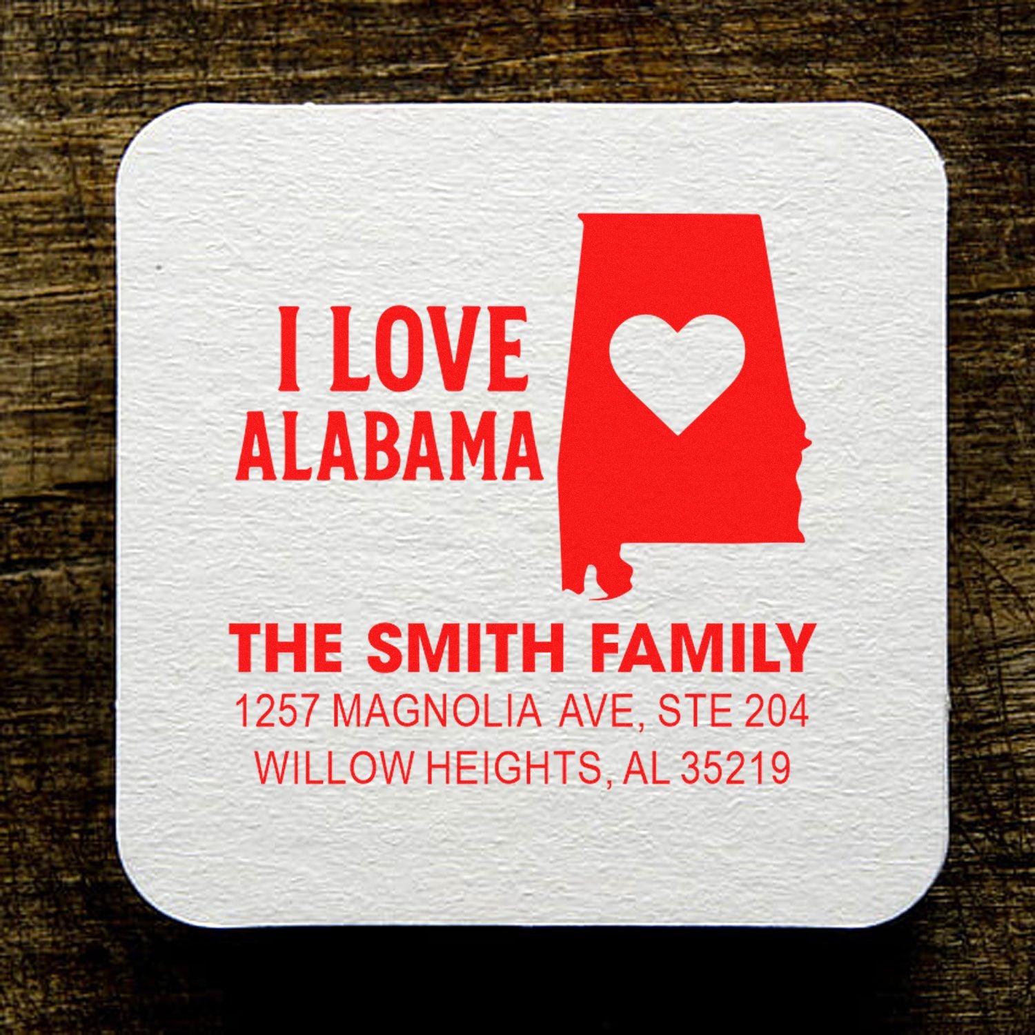 Personalized Alabama return address rubber stamp with heart state design and custom family address.