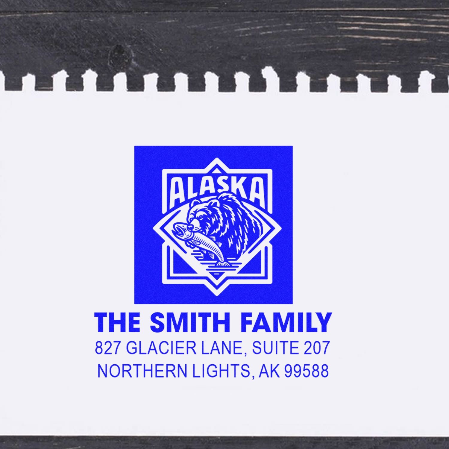 Custom Alaska rubber address stamp for The Smith Family with bear logo and Northern Lights, AK 99588 mailing address.