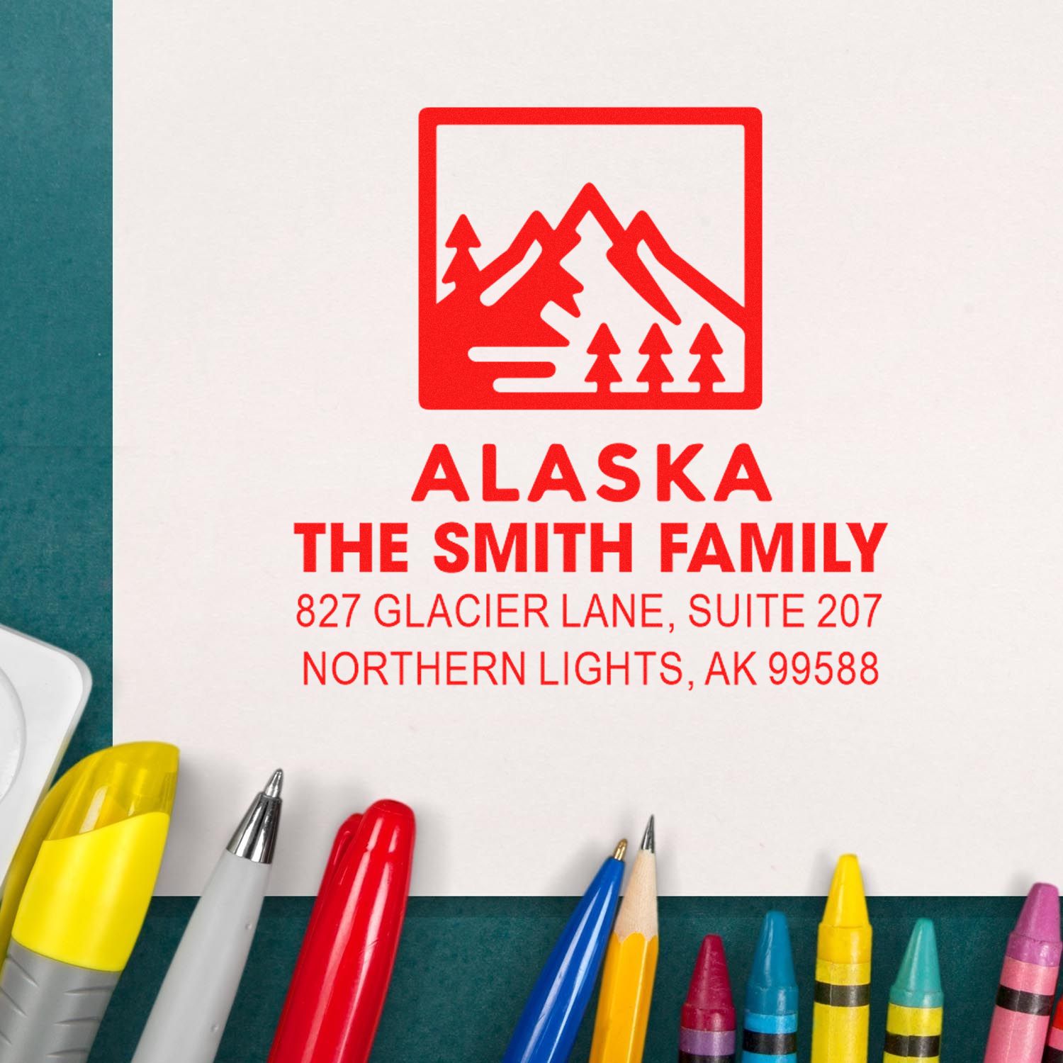 Personalized Alaska return address rubber stamp for The Smith Family with mountain logo and address.