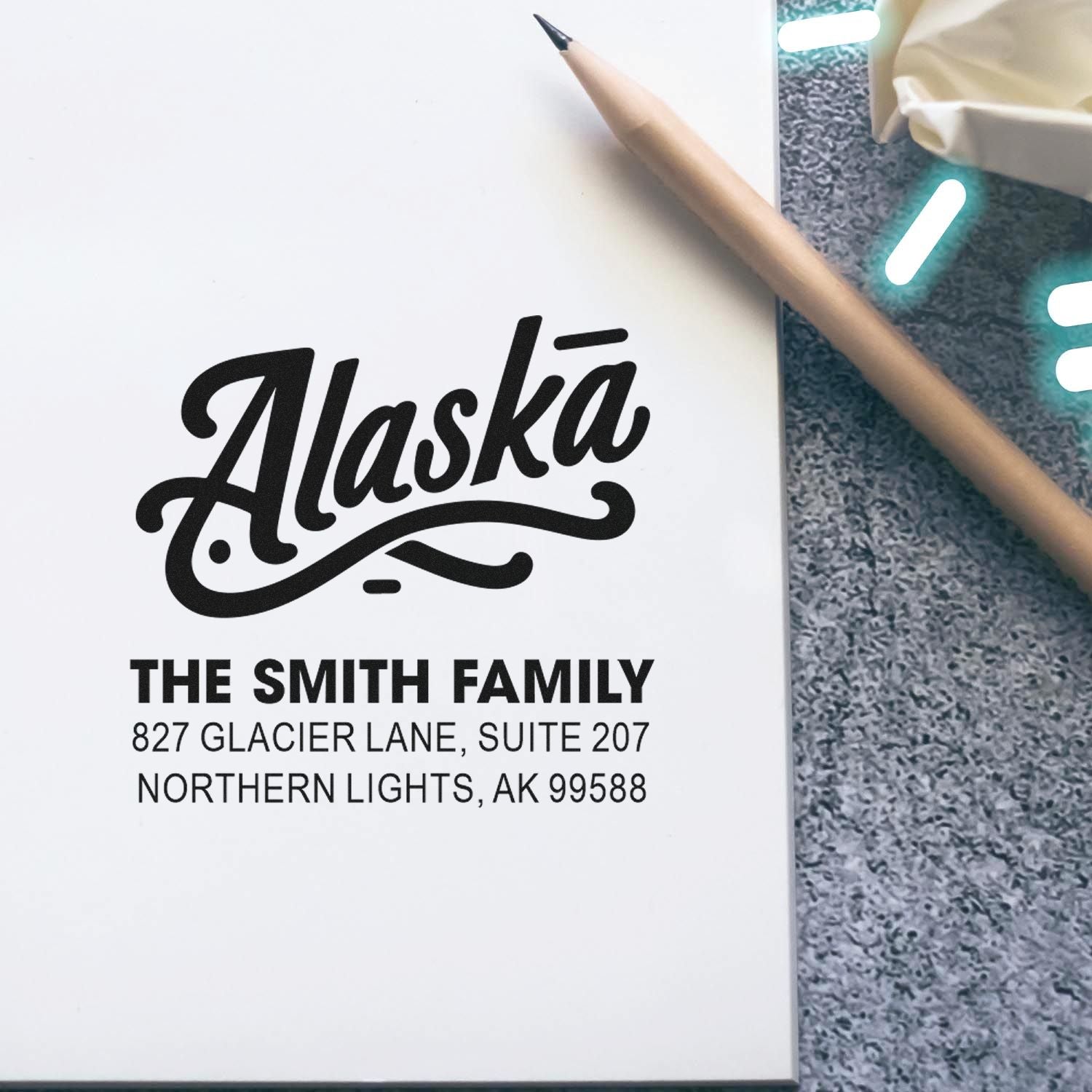 Custom Alaska return address rubber stamp for The Smith Family, featuring name and Northern Lights, AK address.