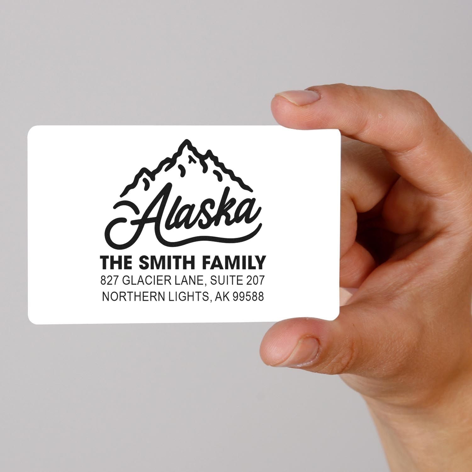 Personalized Alaska return address rubber stamp with mountain logo for The Smith Family mailing address.