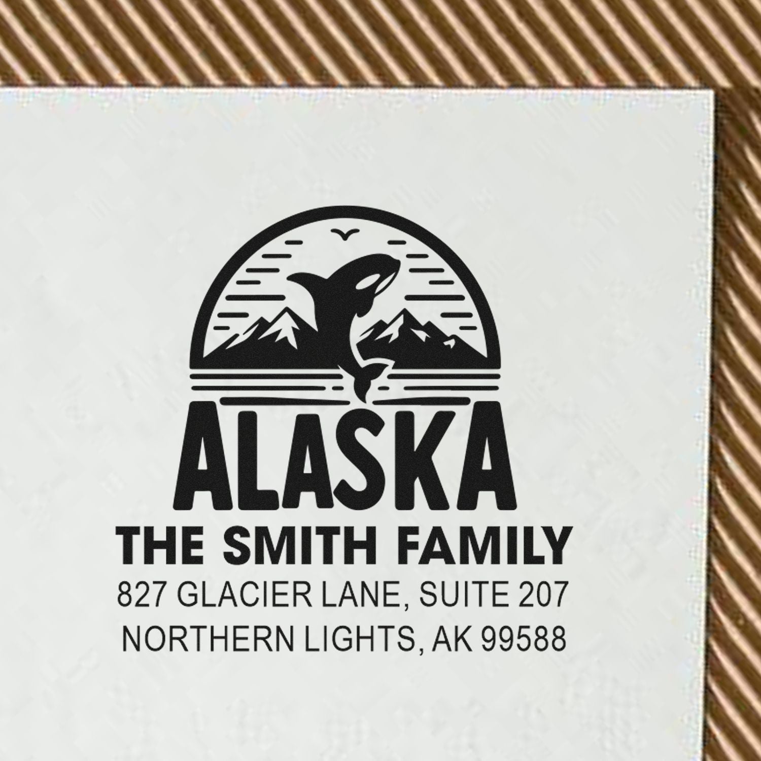 Custom Alaska return address rubber stamp with orca and mountain design for The Smith Family, Northern Lights, AK.
